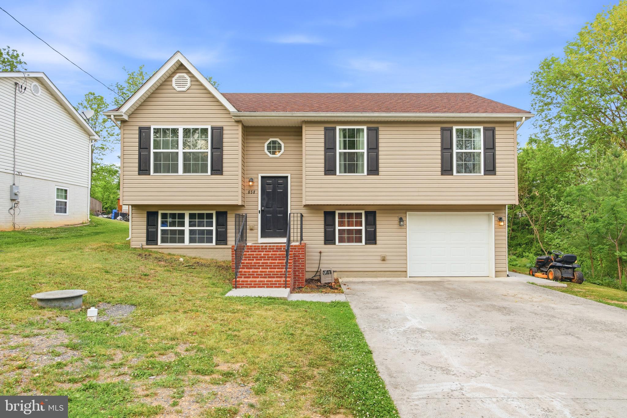3 bedroom, 2 bathroom split foyer convenient to downtown Strasburg, I-81, and Route 11! This home was built in 2013 and has been tastefully updated and carefully maintained. Park in the spacious driveway and enjoy the mountain views before entering through the front door, where you're immediately greeted by gleaming hardwood floors and bright, airy interior colors. On the upstairs level, you'll find the open concept kitchen, dining area, and living room, enhanced by vaulted ceilings and featuring a sliding glass door to the fully fenced back yard. The perfect setup for entertaining! Down the hall you'll find the primary suite, consisting of a bedroom and attached full bathroom, complemented by two more bedrooms and a convenient second full bathroom. On the downstairs level, the unfinished basement offers the ultimate potential, with space for an additional bedroom, home office, entertainment room, or more, along with rough-ins for another full bathroom. Enjoy the added convenience of the attached one-car garage! Located in a residential neighborhood yet only 5.5 miles from I-66, this home offers the perfect combination of privacy and practicality. Schedule your private tour today!
