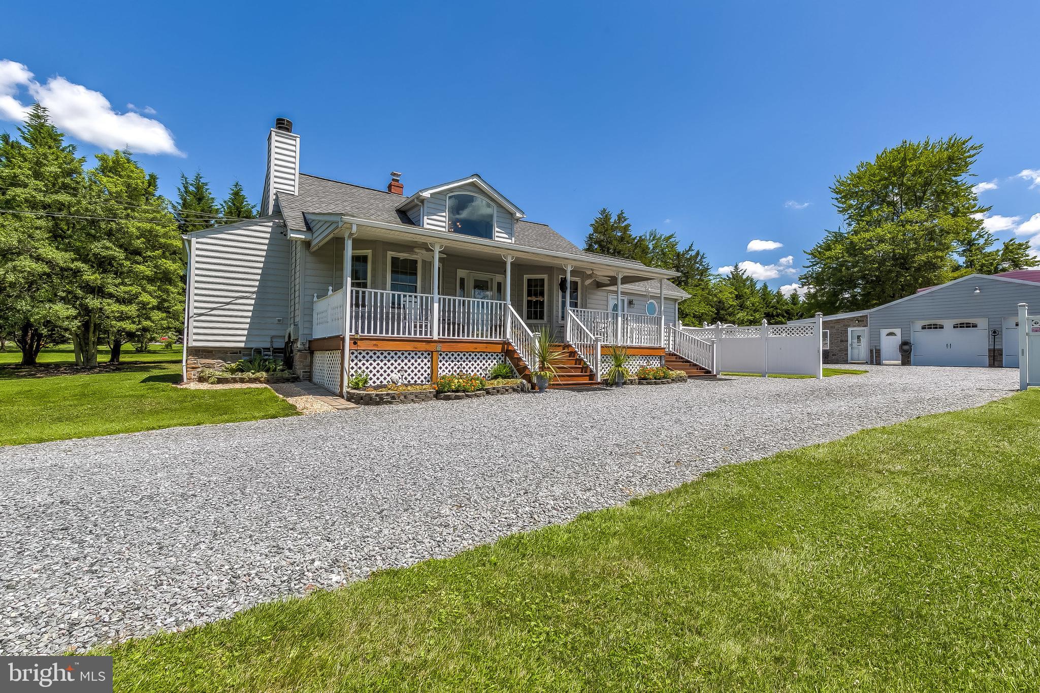 Welcome home to this amazingly charming and unique home that is a car lovers dream come true! Own a business that requires lots of garage space? Look no further, this is the home for you! This immaculate cottage style home is in pristine condition and includes upgraded bathrooms, gorgeous updated kitchen, light and open sunroom, bonus family room/bedroom space, a partially finished basement with tons of storage space, hardwood floors, a charming barn door entrance into the main level bedroom and full bath, and heated garage space galore! One of the garage areas could be converted in rental space or a guest house! New windows 2018, new Trane system 2012, new roof 2015. Won't be active for long! Book your showing today!