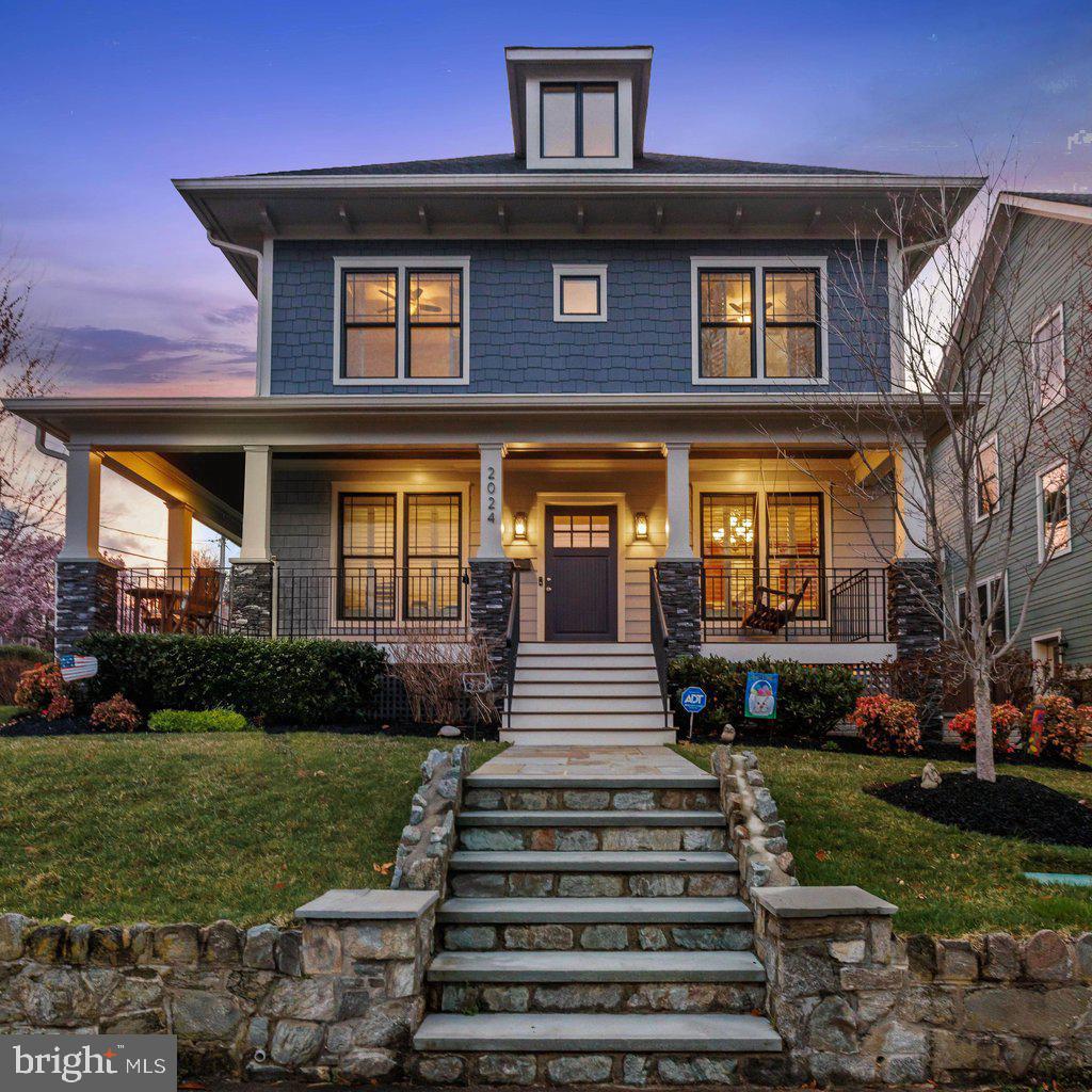 HUGE $100,000 PRICE IMPROVEMENT! Attractive flagstone walkway leads to this stellar craftsman home sited on a thoughtfully landscaped and hardscaped 6,600sf corner lot. Wraparound porch sets this home apart and provides a quiet respite and great vantage point as the home is elevated and set back from the quiet street below. Solid wood front door leads to gorgeous wide-plank, dark stained hardwood. floors throughout the main level that shine in abundant natural light. Details that set this home apart: transom windows, three-piece crown molding
and meticulous craftsman touches, as well as plantation shutters throughout. Grand entertaining space on the main level includes a breakfast nook overlooking the backyard, a family room with beautiful stone hearth gas fireplace and the professionally inspired dream kitchen. Notable chef’s kitchen is anchored by a massive island providing storage, prep-space and bar seating, and features a 36” gas range with oversized oven, under cabinet task lighting, second wall oven, deep under-mount sink and an abundance of cabinet and drawer storage. In addition, the main level includes an office/ study, large formal dining room, butler’s pantry, food pantry, coat closet, mudroom and a convenient powder room. Second floor features four spacious bedrooms, three stylish bathrooms and a large laundry room, as well as numerous linen closets. Enviable owners’ suite includes a huge walk-in closet with custom carpentry organization and a large spa-inspired bathroom, complete with double vanity, deep soaking tub, frameless glass shower enclosure and private water closet. Second guest bedroom suite features walk-in closet and en-suite bathroom, and the third and fourth bedrooms share Jack & Jill style bathroom including private water closet/ shower area. The walk-up third floor includes a spacious loft, perfect for an exercise room or children’s play space, as well as the fifth of seven bedrooms and another en-suite full bathroom. Lower level could double as its own separate apartment, featuring a fantastic rec room centered upon the second gas-fireplace and anchored by a sizable wet bar and open to a game room, ideal for a pool table. Lower level also has the sixth and seventh bedrooms, fifth full bathroom, tremendous storage, a separate room ideal for wine storage or exercise, and abundant windows letting in a surprising amount of natural light. Additionally, this residence includes a large one-car attached garage, driveway parking for two additional cars, private back patio and a fully fenced backyard. Numerous updates and upgrades make this home better-than-new, including multi-zone irrigation system, extensive hardscape and landscape, exterior perimeter security system, multi-zone interior/exterior audio system, plantation style shutters on all windows and convenient Control-4 management system. Supreme location within the most convenient neighborhood throughout the entire D.M.V. – Zero stoplights to Washington D.C., close to Metro, schools, shopping, dining and grocery stores including Whole Foods. Easy access to the Pentagon, Amazon’s new National Landing HQ2 Headquarters, Virginia Tech Innovation Campus, proximity to I-395 and much more!