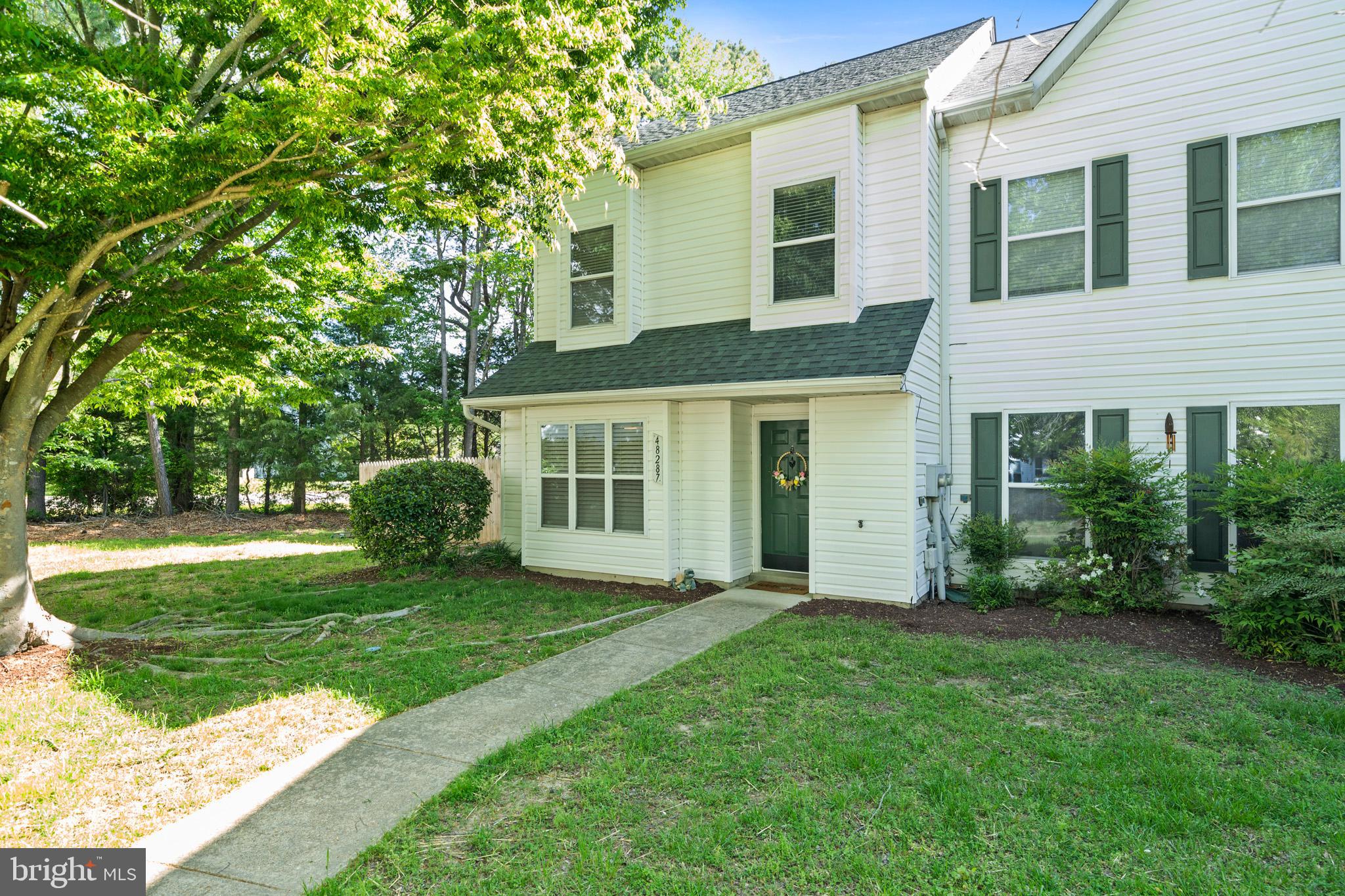 Welcome to this charming end-unit townhouse conveniently located just minutes from Pax River Naval Base in Saint Mary’s County! The main level of this home offers a spacious kitchen boasting an island with additional seating, a large table area, a cozy family room featuring a wood-burning fireplace and a powder room. Off family room, enjoy easy indoor-outdoor living with two sets of sliding glass doors leading to the backyard. Upstairs, the exceptional loft-style primary suite features vaulted ceilings, a separate sitting area and bedroom space, a walk-in closet, and an attached full bath. Upstairs also includes two nicely sized bedrooms, both equipped with ceiling fans, and a full hallway bathroom. Other highlights include heat pump replaced just a few months ago, attached storage shed, a fully fenced lot, and an HOA that covers lawn care, walkable beach access, trash services, snow removal, and more. Don’t miss your chance to get in the door on this one — schedule your showing today!