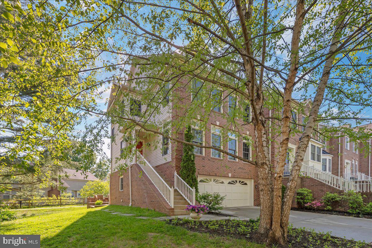Welcome to this stunning 2800 square foot end unit townhome in the heart of the Quince Orchard School cluster, where thoughtful updates, exceptional outdoor living, and an unbeatable location come together in one move in ready package.  From the moment you step inside, the difference is clear. The open concept main level is bathed in natural light, showcasing refinished hardwood floors, newly installed luxury vinyl plank, and elegant touches like crown molding, chair rail, a new chandelier, and the ever popular Agreeable Grey palette.  The beautifully remodeled kitchen featuring abundant counter space  and a center island perfect for gathering flows effortlessly through French doors to your private Trex deck, where sunny mornings and al fresco dinners await.  It's the indoor outdoor connection today's buyers dream about.   Upstairs, the owner's suite is a true sanctuary: soaring cathedral ceilings, an updated ensuite with dual vanities, soaking tub and separate shower, plus an adjoining loft.  The loft is an ideal home office, reading nook, or fitness retreat.  Two additional bedrooms offer generous closet space and fresh finishes throughout.   The finished lower level is where the fun really begins.  A spacious family room with a cozy wood burning fireplace sets the scene for winter nights in, while French doors open to a beautifully hardscape patio with a fire pit.  Your own private outdoor lounge for year round entertaining.  A full bath, wet bar, laundry room with new washer and dryer, and direct access to the two car garage complete this incredibly versatile level.   2800 square feet from top to bottom of refined living space, two spectacular  outdoor areas, and a location close to major commuter routes, shopping, dining, & more!  Homes like this do not come around often and they do not last long on the market.   Schedule your private showing today!