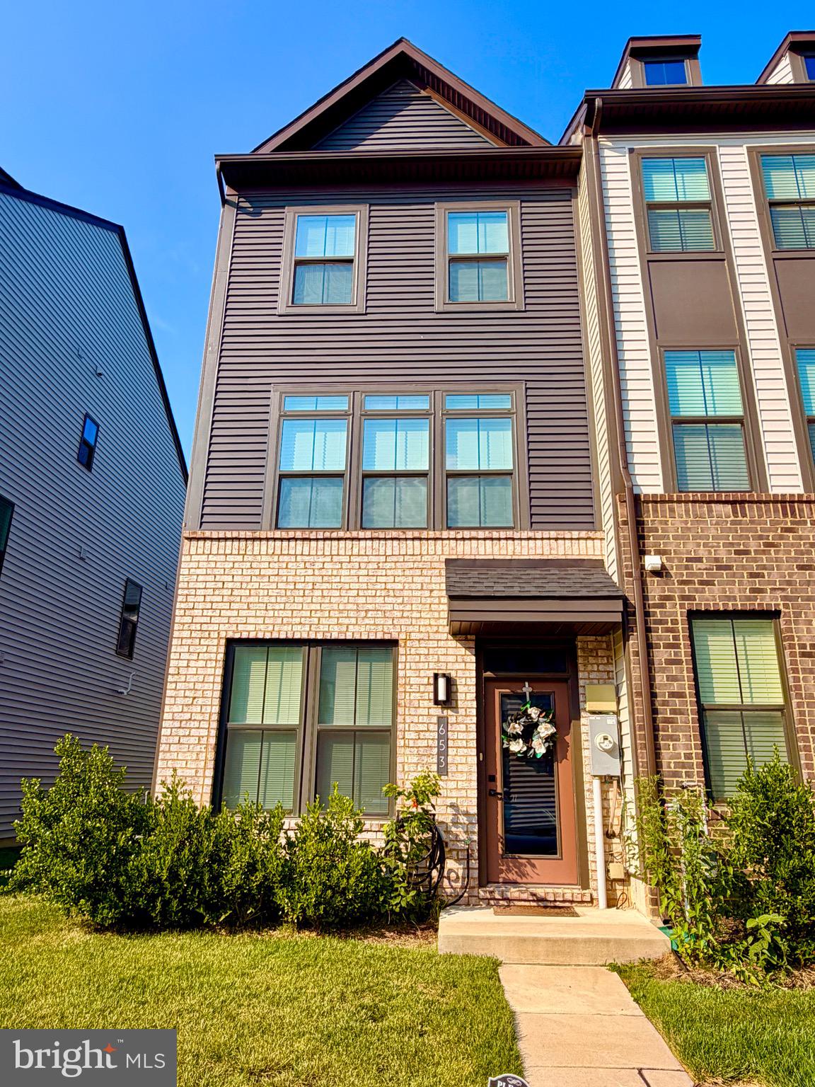 Light-filled, beautifully designed, and built in 2022, this exceptional end-unit townhome offers the perfect blend of modern style, flexible living space, and everyday comfort.

From the moment you step inside, you're welcomed by rich luxury vinyl plank flooring, soaring ceilings, and an abundance of natural light that fills every level of the home.

The entry level offers an oversized bedroom with expansive windows, generous closet space, and a full bath—perfect for guests, multigenerational living, or a private home office. Just beyond, the spacious recreation room features recessed lighting, neutral finishes, and walk-out access to the backyard, creating the ideal space for movie nights, entertaining, or simply relaxing after a long day.

The upper level is the heart of the home, where the stunning open-concept kitchen seamlessly connects the living and dining areas. Featuring rich espresso cabinetry, granite countertops, stainless steel appliances, recessed lighting, and a large center island, this space was designed for both everyday living and effortless entertaining. The adjoining dining area opens to a balcony, creating the perfect spot to enjoy your morning coffee or unwind at the end of the day, while a conveniently located powder room completes the level.

Upstairs, the spacious primary suite is filled with natural light and offers a large walk-in closet along with a private bath featuring dual vanities and a beautifully appointed walk-in shower with built-in seating. The second upper-level bedroom is generously sized, thoughtfully positioned at the opposite end of the hall for added privacy, and features its own en-suite bath and ample closet space. A conveniently located upper-level laundry room completes the floor, adding everyday convenience.

Located in the highly desirable Tanyard Shores community, residents enjoy an impressive array of resort-style amenities, including a clubhouse, outdoor pool, fitness center, dog park, walking and biking trails, picnic areas, playgrounds, pier and water access, and beautifully maintained common grounds. Conveniently located near shopping, dining, Fort Meade, Baltimore, Annapolis, BWI Airport, and major commuter routes, this home offers both tranquility and accessibility.

Whether you're hosting friends, accommodating guests, or simply enjoying everyday life, this thoughtfully designed home offers the perfect blend of comfort, style, and convenience—all within one of Tanyard Shores' most sought-after communities.