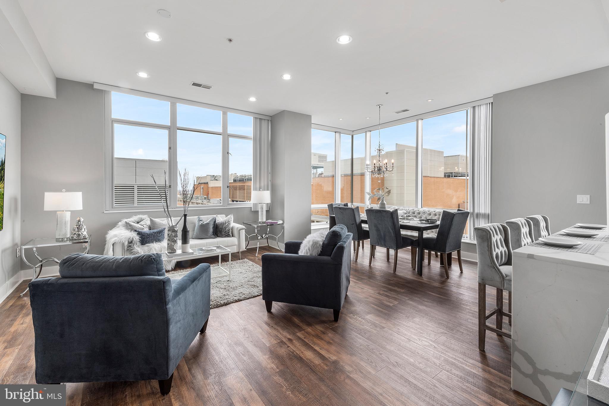 Philly meets Soho in this exceptional corner condo with sweeping views, luxury finishes, high ceilings, 24-hr concierge, and garage parking in Washington Square West. 
Never have 3 bedrooms and 3.5 bathrooms been this affordable in a luxury setting. The massive main living/dining area is sun-drenched open space, with 10-ft ceilings, huge windows, and long-range southern and eastern views. A large bonus room has endless possibilities: a den, dining room, office, gym…totally flexible space to suit your custom needs. The contemporary kitchen dazzles with copious white lacquer cabinetry, stainless appliances, waterfall quartz countertops, island, and bar stool seating. A powder room and laundry room abut the kitchen on either side.
The Primary suite and Junior suite include dreamy walk-in closets, huge windows, extra-large bathrooms with dual vanities, soaking tubs, and glass-framed showers. They are at opposite ends of the unit, providing the utmost in privacy for each space. The third bedroom also includes an en suite bath and ample closet space. Building has extra storage on the 3rd floor and a dog run.
Easy walk to fitness, coffee, grocery, shopping, parks, pickleball, PATCO, Antique Row, the Forrest & Walnut Theaters, the Convention Center, Reading Terminal, the Academy of Music, and the Kimmel Center, not to mention some of the hottest restaurants and night spots in the City. The city’s finest dining, arts, and culture are at your doorstep, along with Jefferson and Pennsylvania Hospitals. 
Designed by award-winning architect Cecil Baker, the historic Western Union Building exudes contemporary, sophisticated style. This rarely lived-in unit feels brand new and will not disappoint.