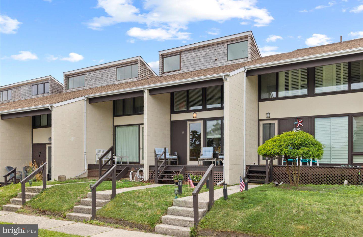 Welcome to North Shores, one of the area's most sought-after amenity-rich waterfront communities Offering a true resort-style lifestyle, residents enjoy access to a private beach, community pool, tennis courts, and marina too! This tastefully remodeled 2 bedroom, 2.5 bath villa is filled with charm and natural light, featuring hardwood flooring throughout the first level, a cozy gas fireplace, private laundry, and an updated kitchen designed for both style and functionality. Expansive windows flood the home with sunlight, creating a bright and inviting atmosphere. Step outside to your own private paved courtyard—perfect for backyard barbecues, sunbathing, or hosting unforgettable al fresco dinners under the stars. The outdoor space also includes a convenient outdoor shower and a spacious storage shed, ideal for surfboards, beach gear, and all your coastal essentials. Upstairs, you'll find two comfortable bedrooms and two recently remodeled bathrooms, providing the perfect retreat after a day at the beach. Homes in the  North Shores Villas are rarely available, and it's easy to see why. Located just steps from the sand  and surf and surrounded by exceptional amenities, this charming coastal getaway offers the perfect blend of relaxation, recreation, and seaside living. Don't miss this rare opportunity to own your own beach retreat in a community like no other!