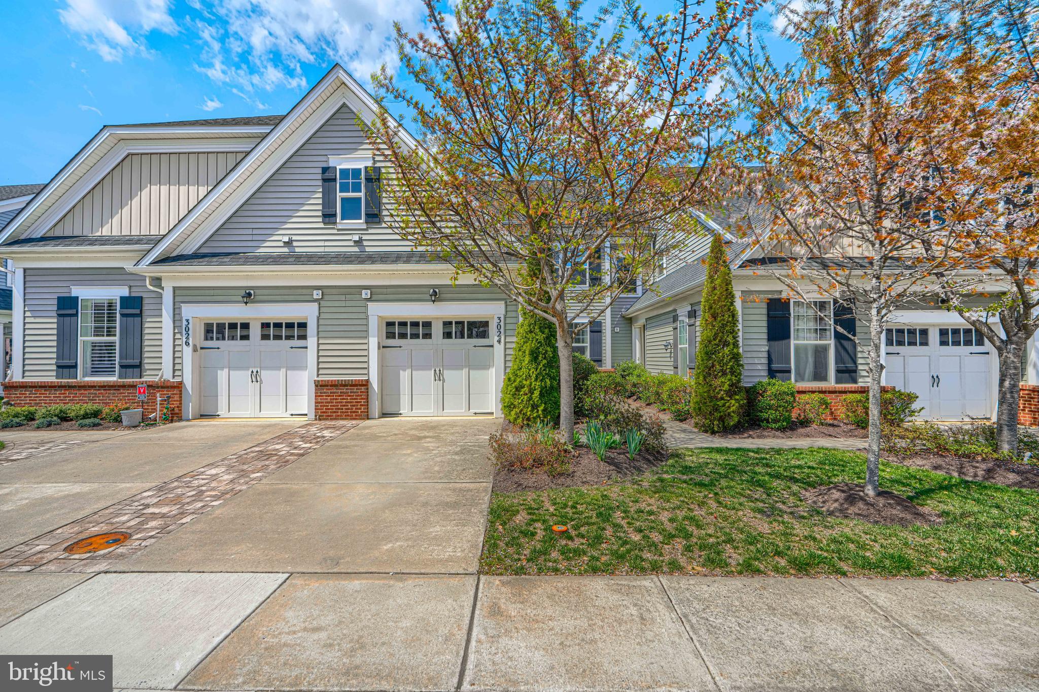 Active Adult Community for 55+  This gently occupied home was built in 2016.   All freshend up giving  a pleasant tour.   You will see that the current owner has made a welcoming home where everything can be done on the first floor, including getting out of your car and walking into your home, avoiding the cold or the rain.  2nd floor offers a bonus of privacy for your visitors.   Long views right from your 1st floor indoor space by the gas log fireplace or from your outdoor patio space, enjoyable through the Spring, Summer and Fall seasons.  Lots of "green space" for your pleasure, maintained by the HOA.  Electric awnings create a shady lounge when needed too, right on your patio, outside your kitchen.  Area streets are designed for slower driving and quieter walks or rides through the neighborhood.  There is even additional parking spaces set for visitors to your block.  Come for a tour, not only of your next home, but your next neighborhood.   Both are impressive.