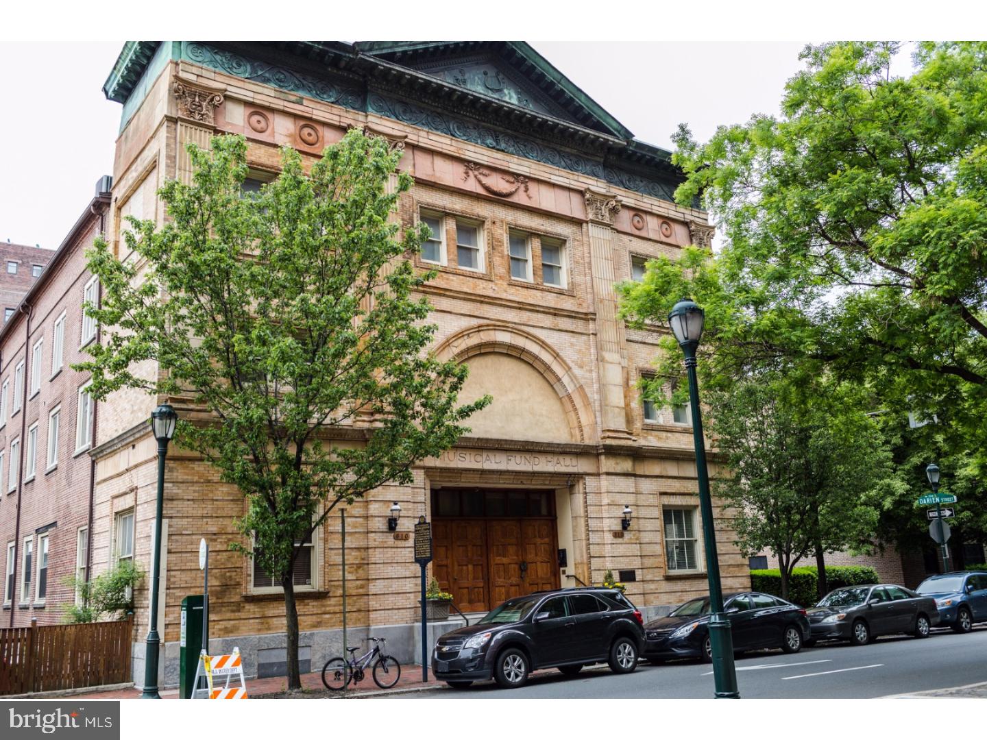 The Washington Square West neighborhood is beckoning you to see this 2,400 square foot, 3 bedroom, 2.5 bath, bi-level condo, with 1 car deeded parking. This chic home is located in the magnificent architectural gem called The Musical Fund Hall, purchased in 1824 by the Musical Fund Society of Philadelphia to provide a permanent performance space for its members. This building is the only historic building in Philadelphia to have been designated a National Historic Landmark ? then removed from the prestigious list. The historic significance of this Boutique Condominium is matched only by an interior crafted with the style, sophistication, and amenities you demand. Be inspired by the expansiveness of this space accentuated by 28 foot soaring ceilings and the dramatic and invigorating effect of natural sunlight from the floor to ceiling windows. To set the mood, there is a romantic working wood-burning fireplace to enjoy in this South-West facing space and electric remote blinds at your fingertips. The kitchen overlooks the main floor and is gorgeous with espresso stained solid wood cabinetry, polished granite counter tops, glass subway tile back splash, an island with water features, seating for 4, stainless appliances, and there is formal dining space for formal dining conveniently positioned for full enjoyment of this massive great-room. 2 ample sized bedrooms are located on the first floor with a full bath that has custom tile work and a large storage vanity. The 2nd floor has 2 sizable flex spaces in the loft overlooking the floor to ceiling custom tiled fireplace, certainly a focal point even from the 2nd floor vantage point. The master suite is located on the upper level as well. These 2 flex spaces can be used as an office, media room, meditation center, library, or whatever suits your needs. The master bedroom suite is stunning with high ceilings, a ceiling fan, plush carpeting, custom fitted closet, and filled with natural light. The en-suite master bath has a frame-less glass enclosed shower with beautiful tile work, a dual sink with storage vanity, and recessed lighting. The main level includes a convenient 1/2 bath, side by side laundry closet, and solid hardwood floors. We encourage you to come and explore this home located in a walk-able, highly desired, and vibrant Center City neighborhood. The building is managed by the Music Fund Hall Condominium Association.