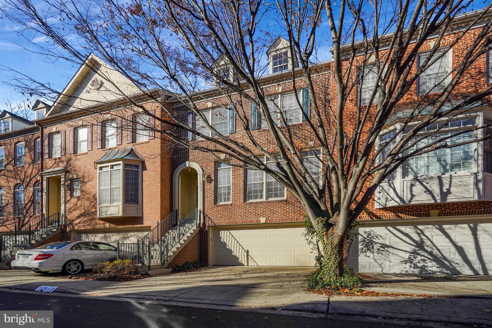 Beautiful townhome in CHANCERY SQUARE community in Fairfax City, VA! This stunning 2-Car garage brick 3 level townhome is composed with 3 Bedrooms, 3 Full Bath, 1 Half Bath, offers a spacious and modern living experience. Step inside and be greeted by the open concept living-dining room, complete with beautiful hardwood floors, crown moldings, and bay windows. The very spacious gourmet kitchen with plenty of cabinets with a breakfast nook in the kitchen offers ample space for meals. Walkout to the rear deck from the kitchen and enjoy a peaceful, private retreat for outdoor dining and relaxation. The main level also includes a family room off the kitchen with a 2-sided gas insert fireplace--perfect for gatherings. On the upper level, the Primary Suite is sure to impress boasting a vaulted ceiling, ceiling fan, large walk-in closet, and an ensuite bathroom with custom ceramic tile flooring, shower, a large soaking tub and dual vanity. The upper level includes 2 additional spacious bedrooms, each with roomy closet space and full hallway bathroom with tub/shower. The lower walkout level features a recreation room with a 2nd gas fireplace, laundry room with washer and dryer, full bathroom, access to the garage and a convenient rear fenced brick patio. This lovely home has been meticulously maintained and just updated with fresh paint throughout and new carpet.  Excellent location, situated just off Chain Bridge Rd. in the heart of the City of Fairfax and just blocks away from all of the shops, restaurants, bars, breweries, farmers market, and other entertainment and events the city has to offer. WALKING DISTANCE to George Mason University including shows and performances at the Center for the Arts, and Eagle Bank Arena. Enjoy the nearby parks/ nature trails at Ratcliffe Park and Van Dyke Park. Commuter's dream with easy access to major commuter routes like Rt 50/Rt 29/Rt 66, 495/95/395 and a metro bus stop at the subdivision for transport to nearby Vienna Metro station. Look no further -- WELCOME HOME!! PROFESSIONAL PHOTOS WILL BE UPLOADED TOMOROW!
