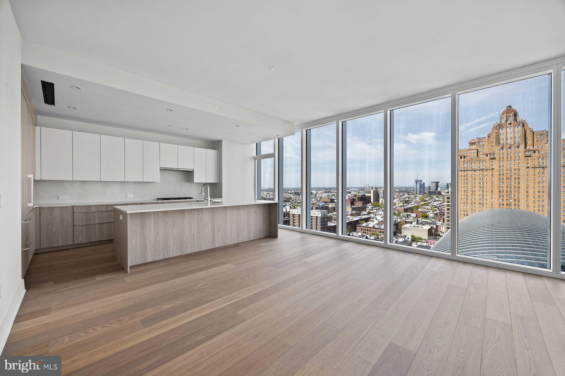 Experience sophisticated city living at  Arthaus - Philadelphia's premier luxury tower on the Avenue of the Arts. 1901 is a high-floor, light-filled residence offering refined interiors and stunning skyline views. This highly desirable unit design features three bedrooms, one with an exclusive, custom door connecting to the great room. Throughout the interior a stunning white and silver ash palette paired with Fendi floors creates a sleek, designer foundation - the perfect canvas for layering in your own elevated style.  Arthaus has world-class amenities; everything you could imagine from a 75 ft indoor lap pool to a sky garden, a dog run & spa, 24-hour concierge, chauffeur-driven town car and so much more. Your purchase includes 1 parking license for valet parking, and a 10 year tax abatement.