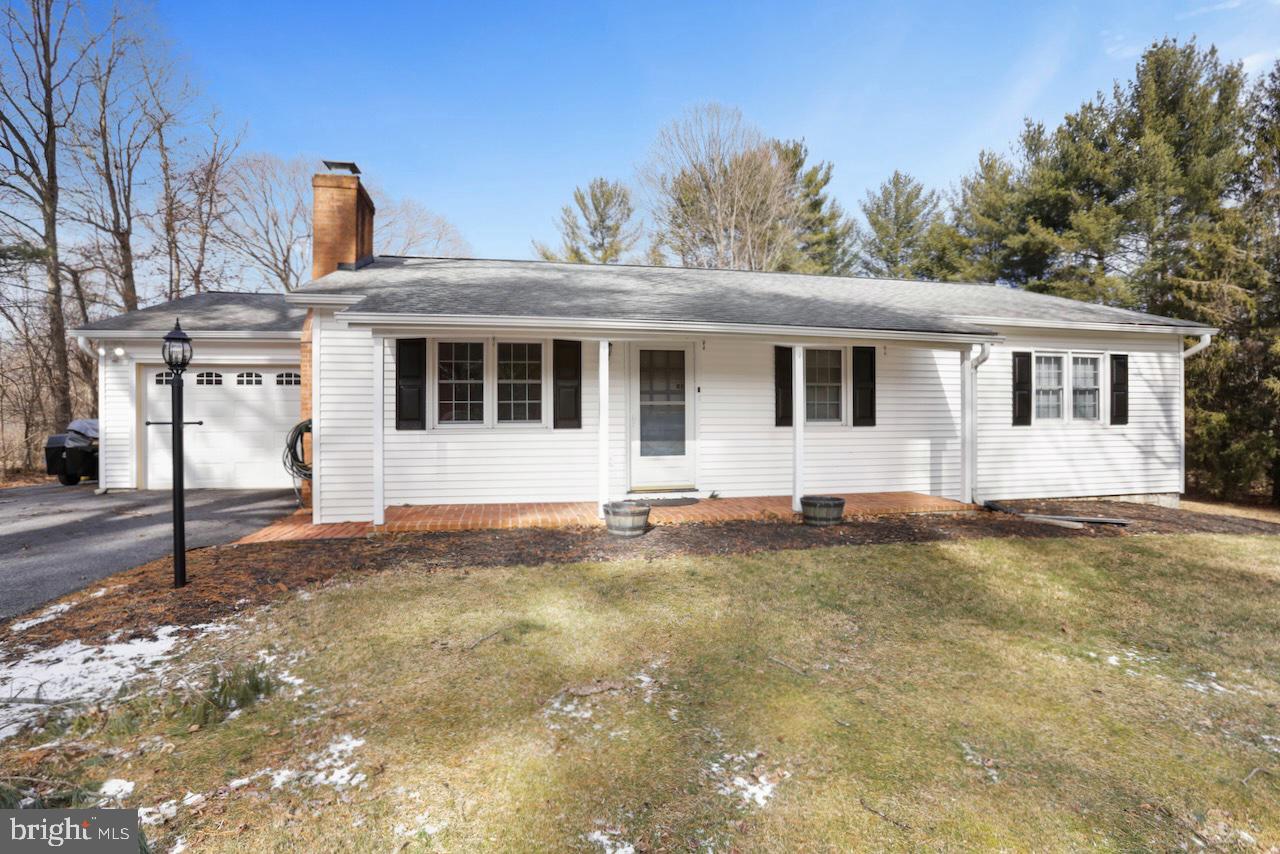 Nestled on a picturesque seven-acre lot in Purcellville, VA, 15439 Berlin Turnpike offers the perfect blend of modern comfort and peaceful country living. This beautifully maintained four-bedroom, three-and-a-half-bathroom ranch-style home features a thoughtfully designed layout with spacious living areas, a fully finished lower level, and stunning outdoor spaces. Luxury vinyl plank flooring extends throughout the home, but beneath it lies hardwood flooring in good condition that simply needs refinishing to restore its original charm. Recent updates, including newer siding and replaced windows, ensure long-term peace of mind, while the property’s serene natural setting provides a private retreat just minutes from town amenities and major routes.  

The main level features a well-appointed primary suite with a private bath, along with two additional bedrooms and a full hall bath. The open-concept living areas include a gourmet kitchen with granite countertops, stainless steel appliances, and ample cabinetry, ideal for both everyday cooking and entertaining. A cozy fireplace in the living room adds warmth and character to the space.  

The finished lower level offers a versatile layout, including an additional bedroom, a full bath, a spacious family room, and a kitchenette with granite counters. The kitchenette is thoughtfully designed with a built-in dining area and ample storage, adding both convenience and functionality to the space. This level is perfect for multi-generational living, guest accommodations, or recreational use.  

Outside, the property’s beautifully landscaped grounds include seasonal blooms, raised garden beds, and a firepit, creating a peaceful setting for relaxation and outdoor gatherings. With frontage on Catoctin Creek and mature wooded areas, nature lovers will appreciate the scenic beauty and wildlife that surround the home.  

This home has been meticulously maintained with numerous upgrades, including all-new PVC pipes for the septic system (November 2019), a new well pump (March 2019), a new HVAC system and heat pump (November 2024), and a new pressure tank (2018). A UV light and filter have been installed on the newer 50-gallon water tank for improved water quality. In 2023, the attic was fully insulated and redone, including the addition of stairs for easy access. Additionally, the roof and storage shed roof are scheduled to be replaced in April 2024.  

Located just minutes from downtown Purcellville, this home offers the tranquility of rural living with the convenience of nearby amenities. Commuters will appreciate easy access to major routes, making travel to surrounding areas simple and efficient. Offering both modern comforts and a stunning natural setting, this exceptional property is ready to welcome its next owner. Schedule your private tour today!