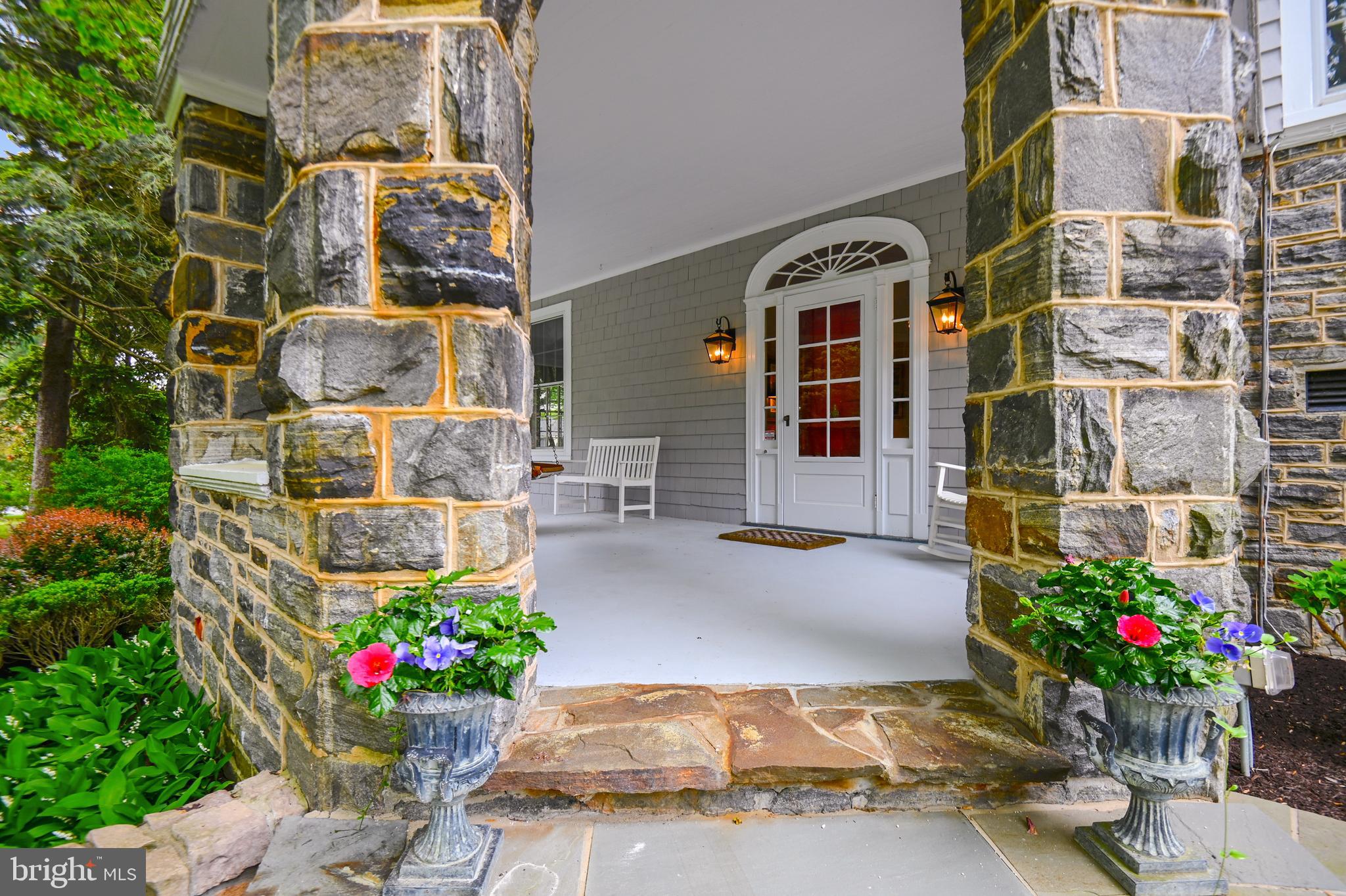 PRIME LOCATION IN THE HEART OF RUXTON!   Situated on a 3.12 acre lot+/- , this property is beautifully landscaped and set back off the road!  Available for the first time in 30 years -  Built in 1900, this wonderful  stone and shingled home has three finished levels.  Offering a large entrance hall with formal living room w/wood burning FP, dining room, eat-in kitchen and family room w/gas FP and valuted ceiling on the first floor.  2nd floor includes the primary suite, dressing/sitting rm and ensuite bath, 3 additional BR's with hall bath.  One bedrm and full bath on the 3rd floor, along with a playroom, office/bedroom and a walk in cedar closet.   Lower level includes a utility room, exercise room and and storage.  Inground pool, pool house with kitchenette and full bath. 
One of Ruxton's finest, put this one on your list to see!