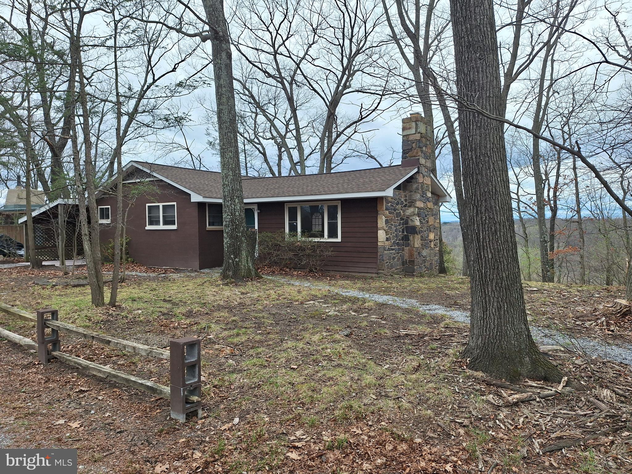 Welcome to Serendipity! A most fortunate find with stunning views of the Shenandoah River. Located on a very quiet dead end street in Blue Ridge Acres, with riverfront park, boat ramp and pool, is just 10 minutes from the VA or MD line. Many recent upgrades to this Mid-Century Modern home: roof, Wifi controlled mini-split heat pump,  plus powerful oil furnace and central air. Cathedral ceiling great room with hardwood floors and stone fireplace, partial basement for storage, laundry, and storage.. located on  nearly an acre site that requires very little maintenance.. Make this your legacy property.