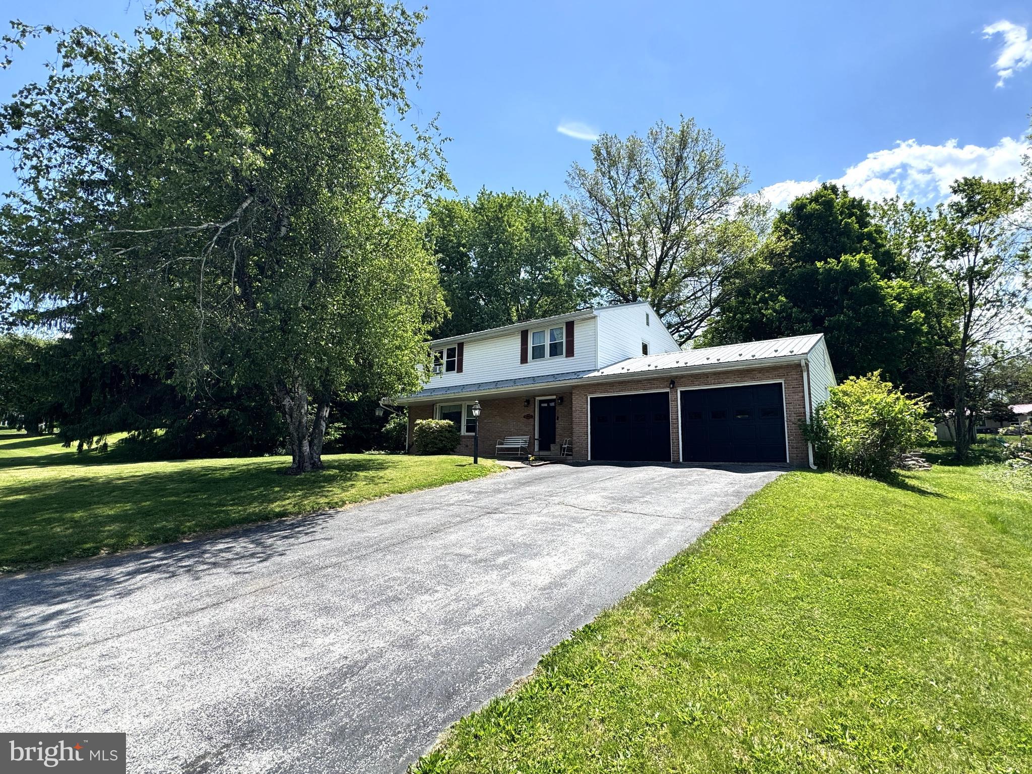 This lovely home in Pleasant acres features a nice open flow layout, first floor bedroom or office, 3/4 bathroom, big foyer with coat closet, pantry, hardwood floors, & updated tile floors. The 2nd floor boosts 4 bedrooms all with hardwood floors and a full bathroom. Full basement that could be finished with extra living space and laundry room. The back yard offers great privacy with a firepit, patio, mature trees and space to make your own.  A large 2 car attached garage, paved driveway and a newer metal roof. Let’s make this home for you!