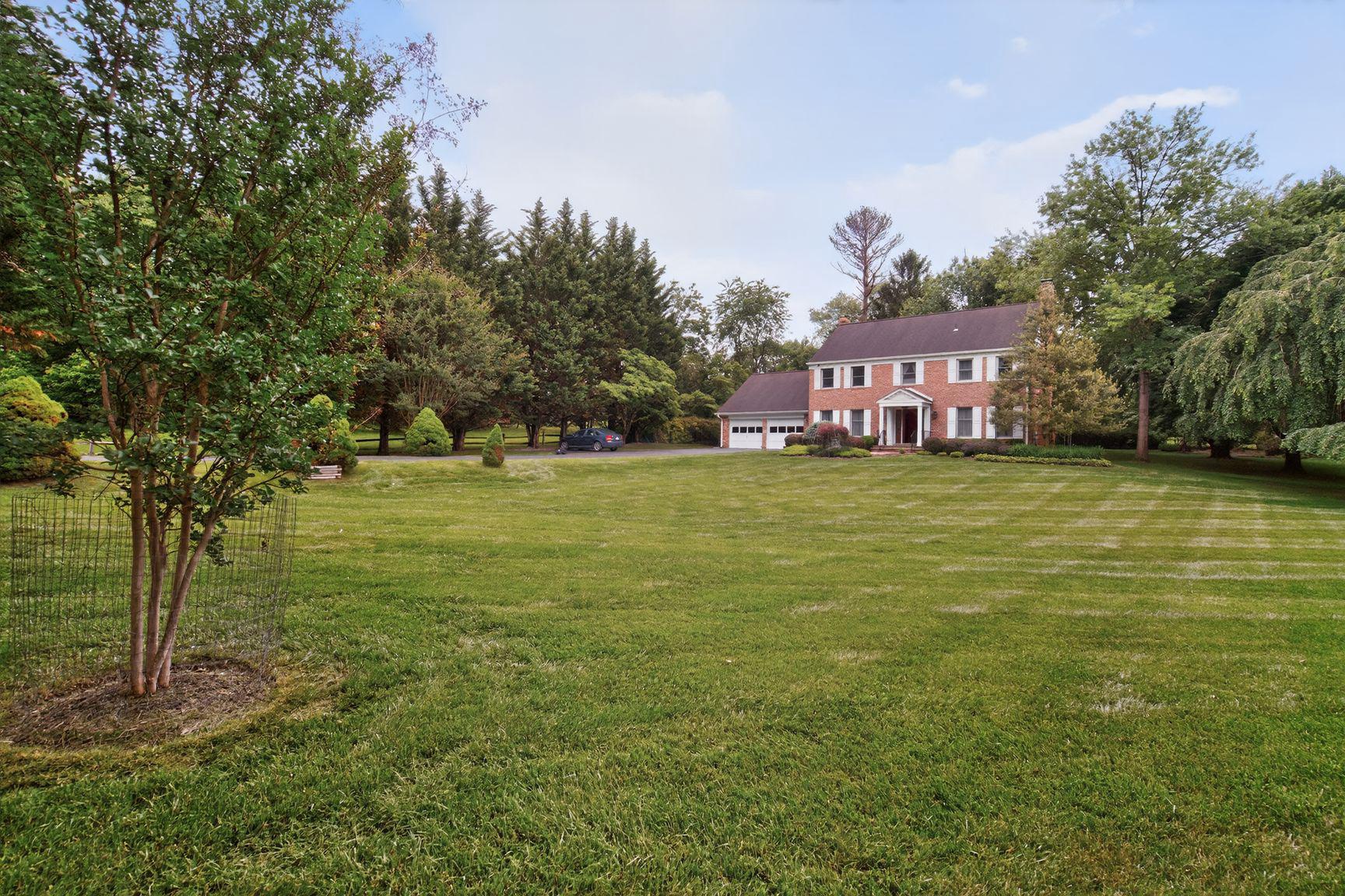 A rare opportunity to own over Two private Acres in one of Rockville's most desirable neighborhoods and school districts. Enjoy luxury living in Lakewood Estates! This beautiful brick front Colonial boasts over 5,000 square feet of space on all 3 levels including an oversized two-car attached garage. The huge sunroom addition provides ample space for family gathering and entertainment. It features vaulted ceilings, skylights and view of beautiful backyard. Two home offices (main level and lower level). Two fireplaces. Refinished hardwood floors. Gourmet kitchen with double ovens and upgraded JennAir Cooktop! Upper level serves as a peaceful retreat with 4 generously sized bedrooms and 2 renovated full bathrooms with designer tiles. Primary suite features a large en-suite bath with soaking tub and separate shower. Lower level finished basement has a recreation room, 2nd home office, wine cellar and utilities room. The quiet and spacious backyard surrounded by mature trees and lush greenery is your personal oasis of peace in the bustling city! Two HVAC units (one replaced in 2024). New water heater (replaced 2-3 years ago). Great location near vibrant shopping, dining and entertainment of Rockville Town Square. Enjoy this serene and private 2-Acre luxury living in Lakewood Estates of Rockville!