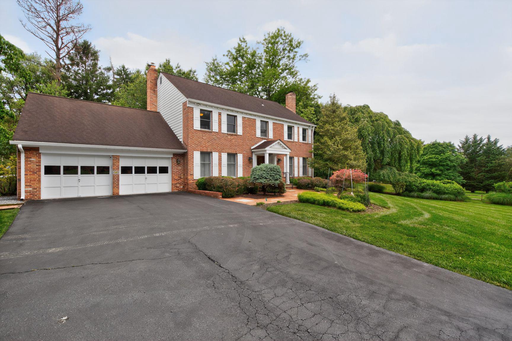 Nestled on a massive, ultra-private 2-Acre lot, this beautiful brick front Colonial boasts over 5,000 square feet of space on 3 levels including a two-car attached garage.  The spacious main level features an inviting living room, dining room, home office, gourmet kitchen, cozy family room, wet bar, powder room and expanded sun room addition with vaulted ceiling and skylights.  Two fireplaces.  Upper level serves as a peaceful retreat with 4 generously sized bedrooms and 2 upgraded full bathrooms with designer tiles.  Primary suite boasts a walk-in closet and a large en-suite bath with soaking tub and separate shower.  Lower level basement features recreation room, bonus room for workshop/study, wine cellar and utilities room.  Step outside into your own private oasis!  The spectacular backyard looks like a park, surrounded by mature trees, lush greenery and open space.  Two HVAC units (one replaced in 10/2024).  New water heater (replaced about 2 years ago).  Convenient location near vibrant shopping, dining and entertainment of Rockville Town Square.  Wootton School Pyramid!  Enjoy this serene and private 2-Acre luxury living in Lakewood Estates!