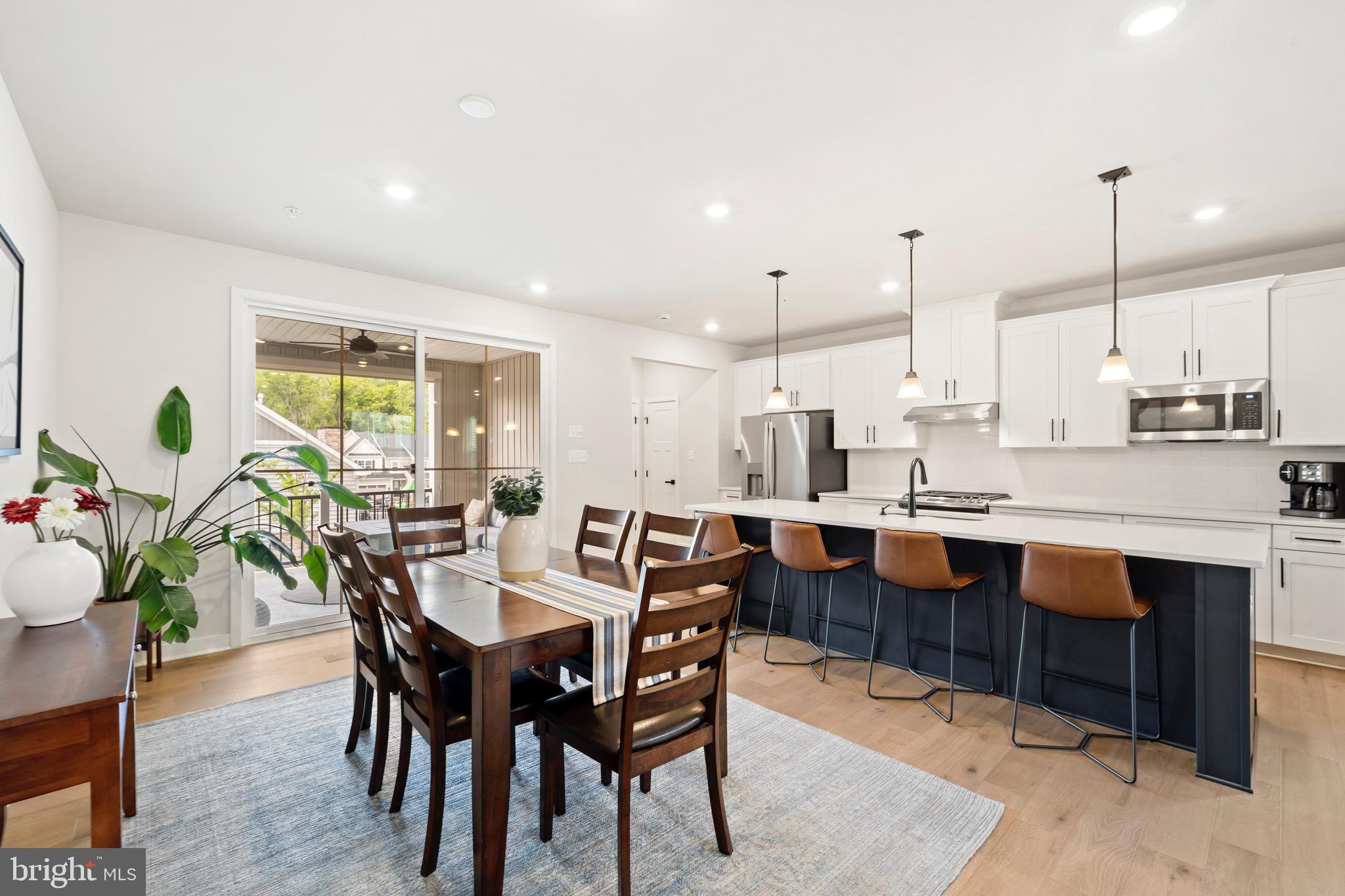 Welcome to this thoughtfully upgraded, 3-year-young townhome in the highly sought-after Ponds Edge community in Media. This 3-bedroom, 2.5-bath Serenade model End-Unit combines modern design, luxury finishes, flexible living space, and low-maintenance convenience—all in an unbeatable location.
The bright, open-concept main level features stunning 6.5” Timbre Brushed Silver engineered hardwood flooring and an ideal layout for both everyday living and entertaining. Enter through the spacious Great Room, filled with abundant natural light from its many windows. The gourmet kitchen serves as the heart of the home, complete with a large center island with seating for four, Silestone quartz countertops, an upgraded appliance package, soft-close cabinetry, and a convenient pantry.
The adjoining dining area flows seamlessly to the expanded covered porch featuring a cozy gas fireplace—perfect for year-round enjoyment. A convenient powder room completes the main level.
Upstairs, the spacious primary suite offers a true retreat with a tray ceiling, walk-in closet, and luxurious en-suite bath featuring dual vanities and an upgraded Roman shower with dual shower heads and bench seating. Two additional bedrooms, a full hall bath, linen closet, and  upper-level laundry complete the second floor.
The finished lower level offers exceptional flexibility, making it ideal for a media room, office, playroom, gym, or additional living space. This level also includes an arrival center off the attached two-car garage, coat closet, and two storage rooms.
Additional upgrades include custom blinds throughout (with motorized blinds in the Great Room), dining room wiring for chandelier installation, a gas line hookup in the garage for grilling convenience, black hardware & finishes throughout, and ceiling fans installed in all three bedrooms, the Great Room, and porch for added comfort.
Residents of Ponds Edge enjoy exceptional community amenities, including a clubhouse with a fitness center, playground, walking paths, lawn maintenance, and snow removal. Ideally located just minutes from downtown Media, the Promenade at Granite Run, and SEPTA’s Wawa Station for easy access to Center City Philadelphia.
This move-in-ready home offers the perfect blend of luxury, comfort, and convenience in one of Delaware County’s most desirable communities.
**Special Financing Incentives available on this property from SIRVA Mortgage**
