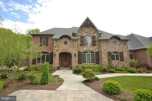 Exceptional 6BR/5fullBA/2half BA, custom stone and brick home. w over 8000+ sq ft of living.  Amenities abound with exquisite details and finishes throughout.  Extensive woodwork, wide planked reclaimed hardwood, beamed ceilings, deep moldings.Gourmet Kit and butler's pantry. Private setting with serene views. 3 car gar w custom builtins. Irrigation system. Gated entry.