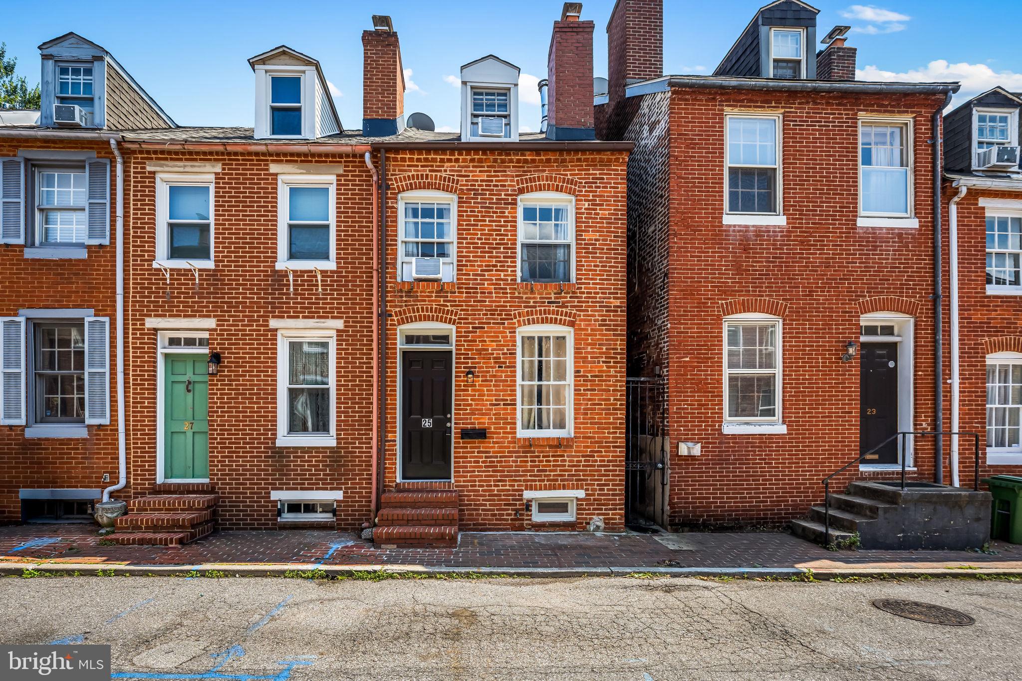 Imagine starting your morning with coffee on the private deck just outside the second floor rear bedroom, then heading out to enjoy everything Federal Hill has to offer. This 3 bedroom, 2 full bath rowhome is tucked away on a quiet street while still placing you close to Cross Street Market, Federal Hill Park, neighborhood restaurants, the stadiums, and the Inner Harbor. Inside, exposed brick, wood floors, and historic details give the home its classic Baltimore character. The kitchen features freshly painted cabinetry and opens to a private courtyard that is well suited for outdoor dining or entertaining. With a flexible layout and an attractive price for the location, this is a great opportunity for a buyer looking for character, convenience, and the ability to make the home their own.