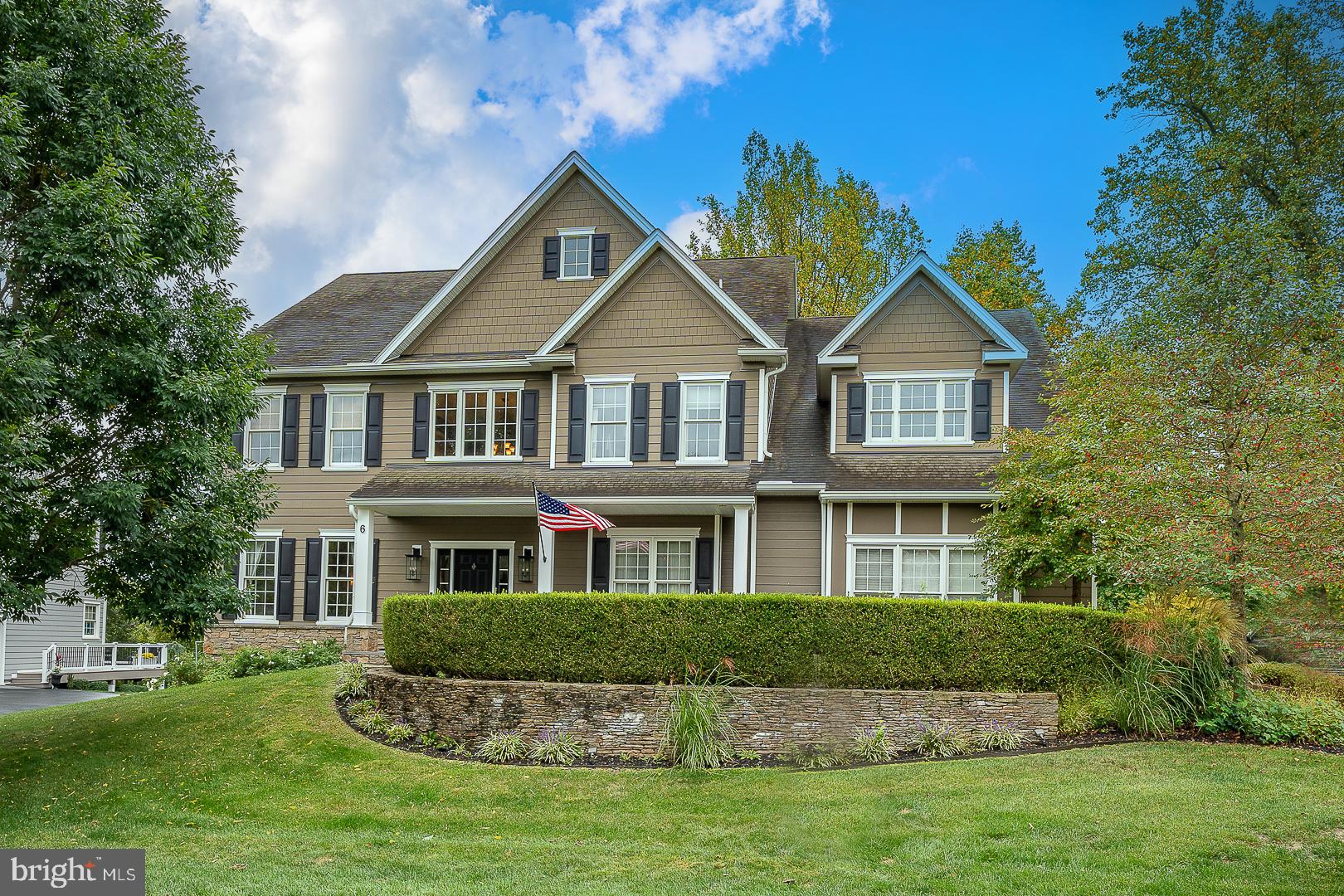 Rarely does a home become available in the Estates at Mill Creek in Thornbury Township, but here it is – a beautiful 2 story, 4 Bedroom, 4,5 Bath Colonial set on a private lot just waiting for its new owners! A boutique neighborhood of cul de sacs is what you will find as you drive into the community – quiet and peaceful.  As you arrive, take in the gorgeous stone retaining wall and home with Hardiplank siding and Stone – truly stunning. Walk into the FRESHLY PAINTED 2 story Foyer with turned staircase and custom millwork on the walls and ceiling.  There are Brazilian Cherry Hardwood floors throughout the Main Level. To the left of the Foyer is the FRESHLY PAINTED formal Living Room with crown molding and wainscoting. To the right of the Foyer you will find the formal Dining Room also with crown molding and wainscoting.  Walk from the Dining Room down the hall with a convenient Butler’s Pantry with cabinetry and wine fridge and back staircase to the upper level. This then leads you to the heart of the home – the Kitchen.  Here you have all a chef needs – an abundance of beautiful cabinetry, large island, granite counters, tiled backsplash, stainless steel appliances and a pantry.  There is a large Breakfast Room with French doors to the oversized Deck.  Open to the Kitchen is the spacious 2 story sun filled Great Room with large windows and a gas fireplace.   We can’t forget to mention the private Office with French doors – perfect for those working at home!  Off the Kitchen, there is a mud/laundry room with California closet system giving access to the 3 car Garage.  There is a convenient powder room that completes the main floor.  Moving upstairs, the Main Bedroom has vaulted ceilings, a large Sitting Room, 2 walk in closets and a hall closet – all with California closets systems. The en suite bath has a jetted tub, shower, double sink vanity and skylight.  There are 2 additional Bedrooms and a full hall bath PLUS a Princess Suite with 4th Bedroom, full Bath and walk in closet.   The WALK OUT lower level with large windows and slider to the rear yard is spacious and ready to be finished – there is a FULL BATH already installed so the hard work is done! Under the basement stairs is a small playroom with lights!  Outside there is beautiful stonework and an oversized composite Deck overlooking the woods – very private! Located in West Chester School District, this home is close to shopping, restaurants, parks and major roads. Make your appointment today!!!