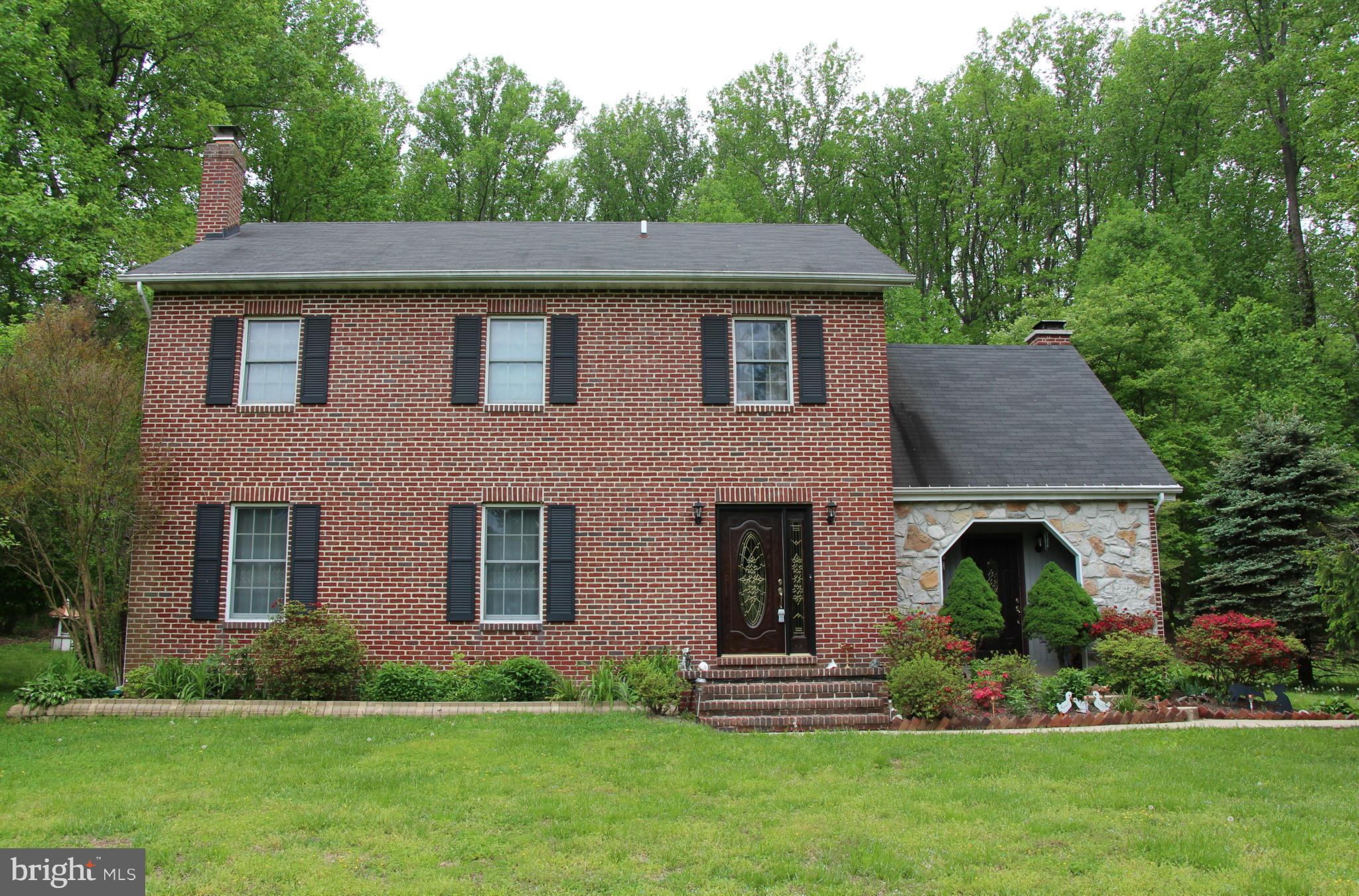 PARADISE DESCRIBES THIS 4 BEDROOM 2 1/2 BATH BRICK/STONE COLONIAL WITH 2 FIREPLACES SITUATED ON 3.56 ACRES.  SERENE FRONT YARD WITH MATURE FRUIT TREES.  BACK YARD OASIS IS LIKE BEING ON VACATION WITH A HEATED INGROUND POOL W/ ATTACHED HOT TUB SURROUNDED BY BEAUTIFUL LANDSCAPING.   YOU DON'T WANT TO MISS THIS ONE!