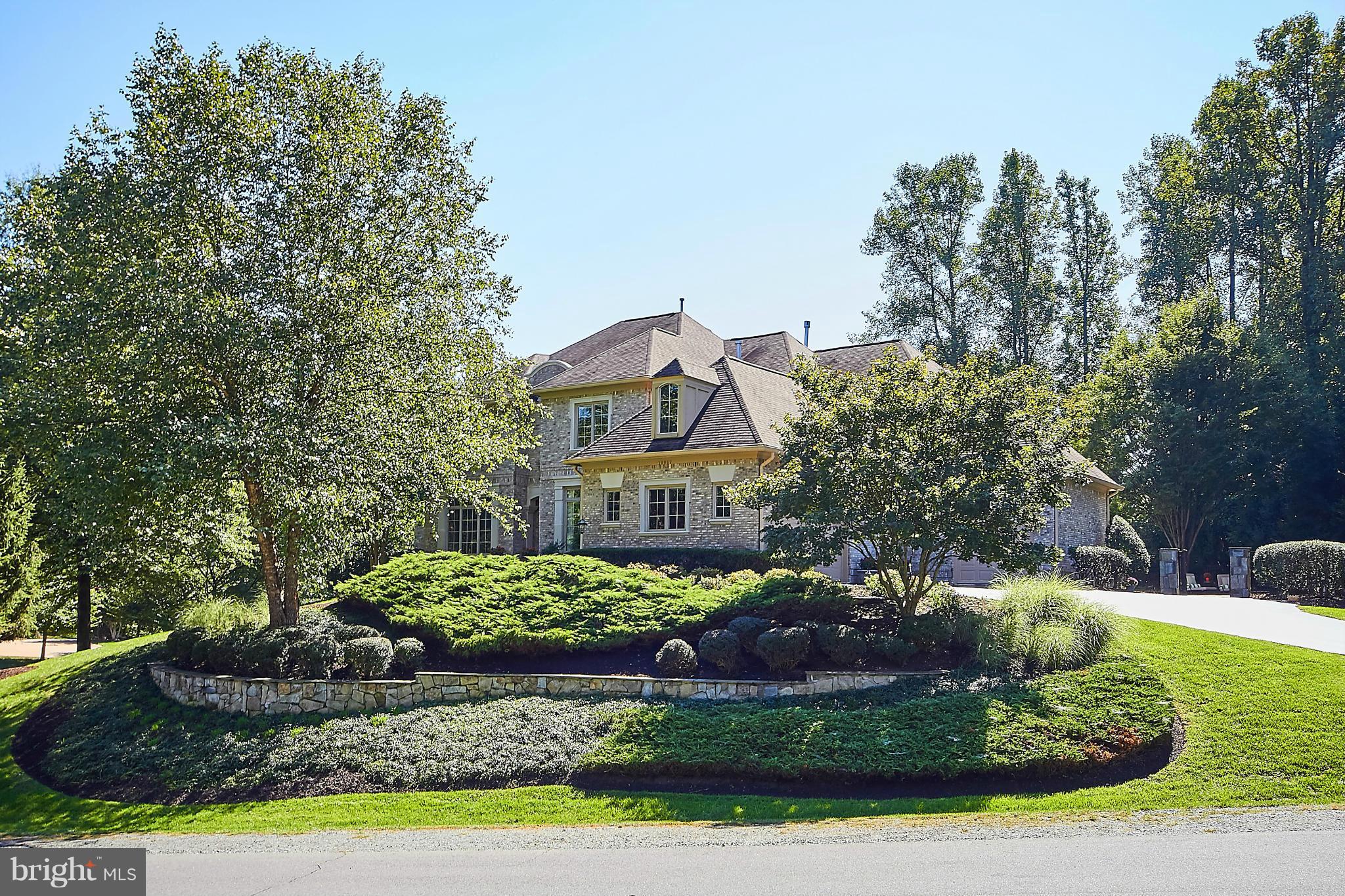 WOW! THIS IS A MUST SEE! WON'T LAST! Resort-style living! Award-winning architectural design. Dramatic 9'+ ceilings on 3 lvls. Magazine-worthy kitchen. Holiday-sized dining rm. Sunbathed family rm. Main lvl library. Conservatory wing. Chic master suite w/ fireplace. Renovated master BA. Spectacular club rm, party lounge, fitness rm, theatre, guest suite & full BA renovated 3 yrs ago! Bkyd paradise