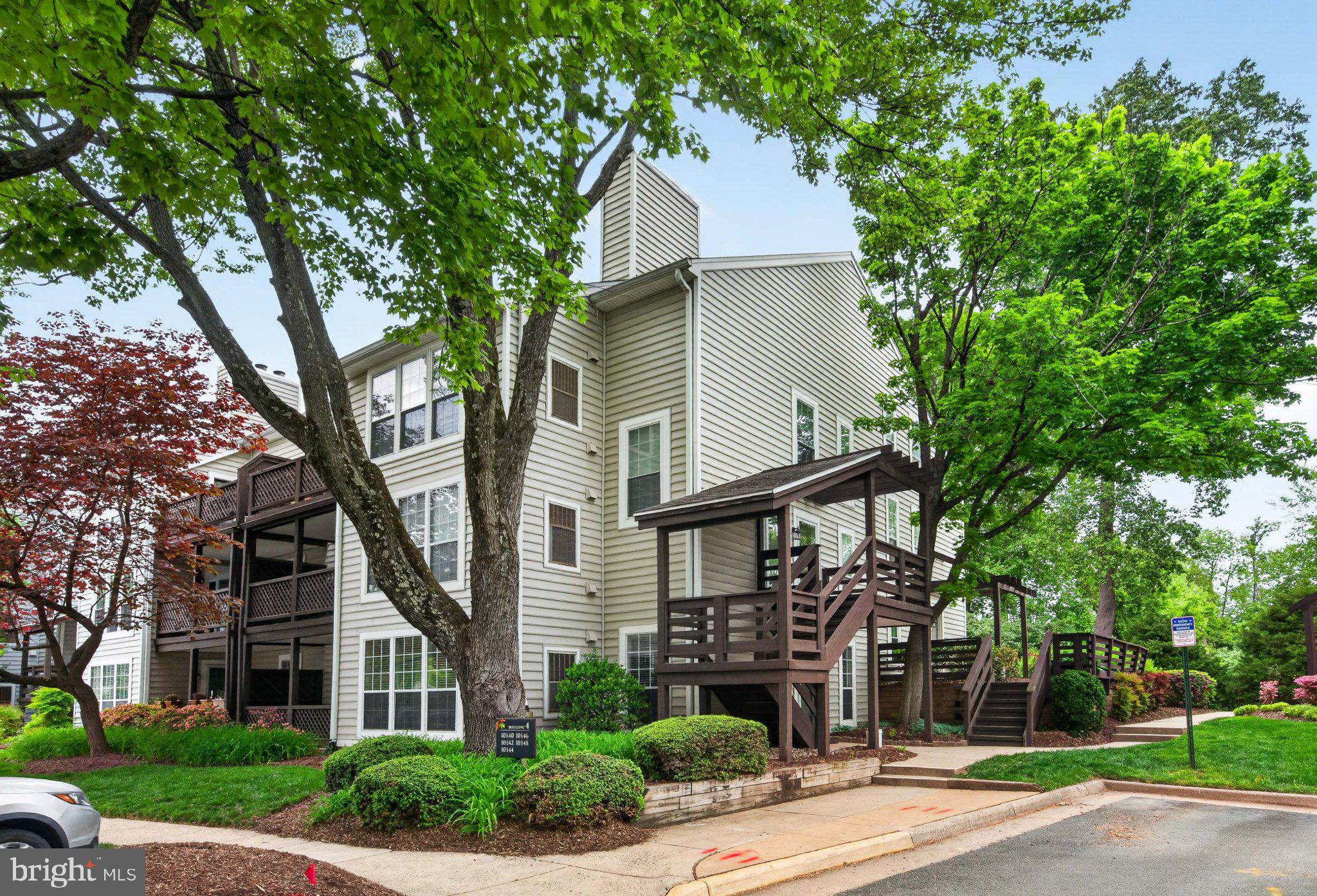Welcome to this rarely available ground-level Dorchester model at The Oakton, an exceptional 1-bedroom, 1-bath residence offering comfort in a charming garden-style community. The heart of the home showcases an updated kitchen, thoughtfully designed with quartz countertops, new flooring, and brand-new stainless steel appliances, perfectly blending style and functionality. Just beyond, a separate dining area is enhanced by a statement chandelier, creating an inviting space for both everyday living and entertaining.  The spacious, light-filled living room features luxury vinyl plank flooring, recessed lighting, a cozy wood-burning fireplace, and custom built-in shelving, adding both character and functional design. 
The fully renovated bathroom has been meticulously redesigned with fine finishes, offering a spa-like retreat. The generous sized bedroom features a custom-finished double closet and a new ceiling fan! Additional storage is abundant with an entry closet, a laundry room closet, and a sizable pantry in the kitchen.  All windows and the sliding glass door have been replaced with thermal-insulated glass, enhancing energy efficiency and year-round comfort.  Step outside to your private outdoor terrace, an ideal extension of the home and the perfect setting for morning coffee or unwinding in a peaceful, natural setting.  Ideally located in a walkable community just moments from Oakton parks, the Vienna Metro, and major commuter routes, residents also enjoy access to a community pool and beautifully maintained grounds.