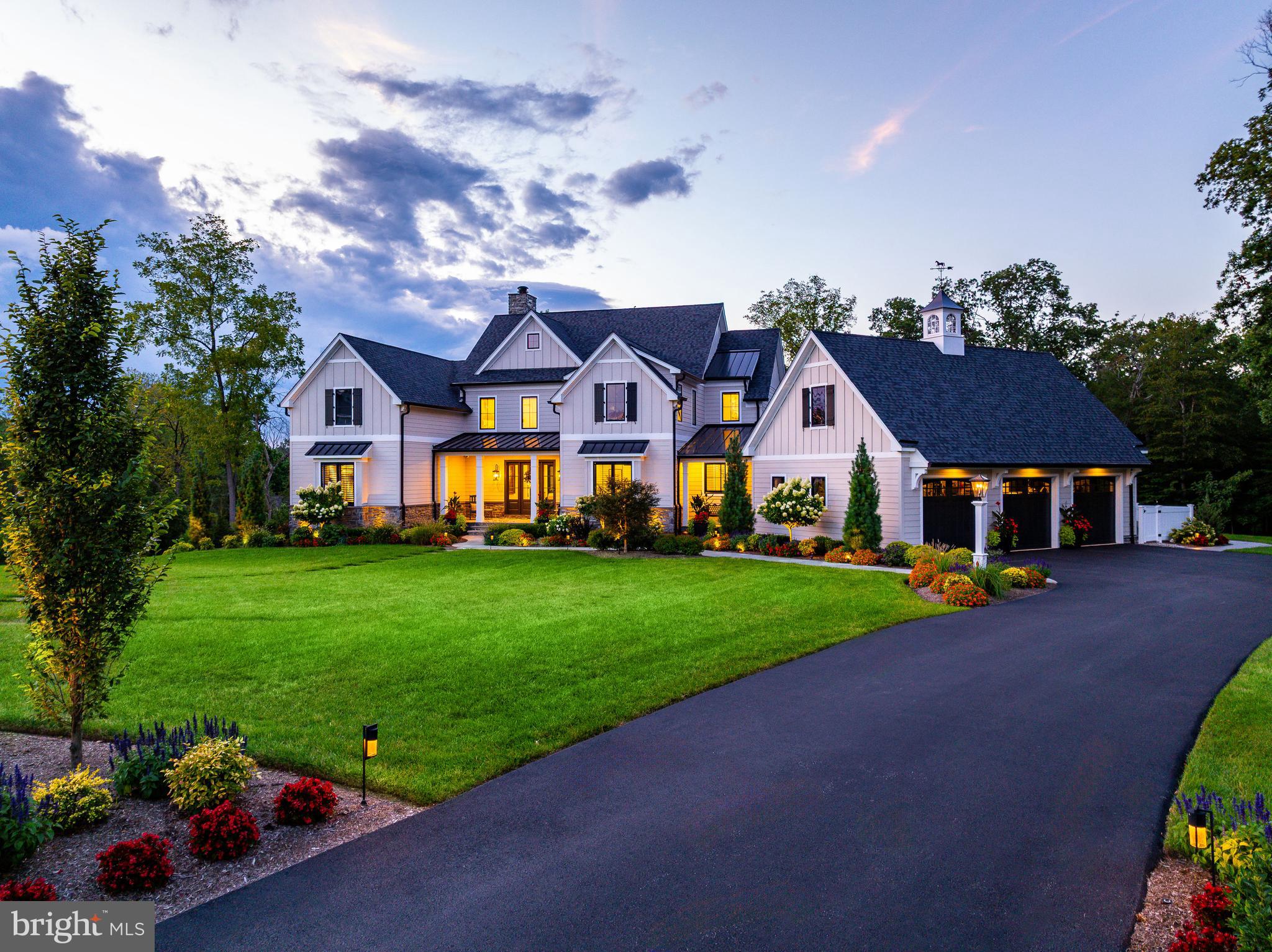 Why travel when home feels like a five-star resort? Welcome to this nearly new 7,000 sq ft custom residence tucked at the end of a quiet Gwynedd Valley cul-de-sac of just seven homes—where everyday living feels like a year-round getaway.
This elegant home has been designed for comfort, convenience and entertaining. The main level offers : a first-floor owner’s suite with vaulted ceilings and sitting area, a spa-worthy bath with heated tile floors, soaking tub, dual vanities, make-up station, and a custom walk-in closet..
Entertaining is effortless with four kitchen areas and three fireplaces. The main kitchen features Wolf, SubZero, and Bosch appliances, quartzite countertops, banquette seating, a coffee bar, and adjoining back kitchen with farmhouse sink, refrigerator, additional dishwasher and pantry for seamless prep. A chic mini-bar with SubZero wine fridge completes the space. Step outside through twin 12’ glass sliders to a covered terrace with skylights, outdoor fireplace and TV, Lynx-equipped kitchen, and expansive dining and seating areas. The heated saltwater pool and spa, expansive decking and with a grotto fire pit—it’s an entertainer’s dream. The fully finished walk-out lower level adds an additional full kitchen, SubZero-equipped bar, gym, full bath, dual-sided fireplace, and recreation areas, in addition to a 12’ slider that leads to a covered patio and the pool area.
Upstairs, a retreat-style loft lounge with bar, three bedrooms (all with custom closets and ensuite or Jack-and-Jill baths), plus a third-floor bonus room, creates flexible living for guests, family, or work-from-home needs.
A 3-stop elevator ensures easy access to all levels, making this a forever home. Every detail has been fortified for peace of mind: whole-house generator, Lutron lighting system, Honeywell security, Luma cameras, Sonos sound inside and out, central vacuum (including garage), three HVAC systems across five zones, two Navien tankless water heaters, a water softener and integrated cabling/Wi-Fi throughout. Car enthusiasts will love the three-car garage with epoxy floors, slat walls, custom cabinetry, and a 240-volt line for an EV charger.
Set on 1.68 private acres that back up to wooded lands, the property offers lush landscaping with irrigation and lighting, and expansive outdoor living spaces. Proximity to the Gwynedd Valley train station, Wissahickon Trails, and Lower Gwynedd’s scenic walking paths complete the picture.
This is not just a home—it can also be your luxury staycation home.  Call for your showing TODAY!