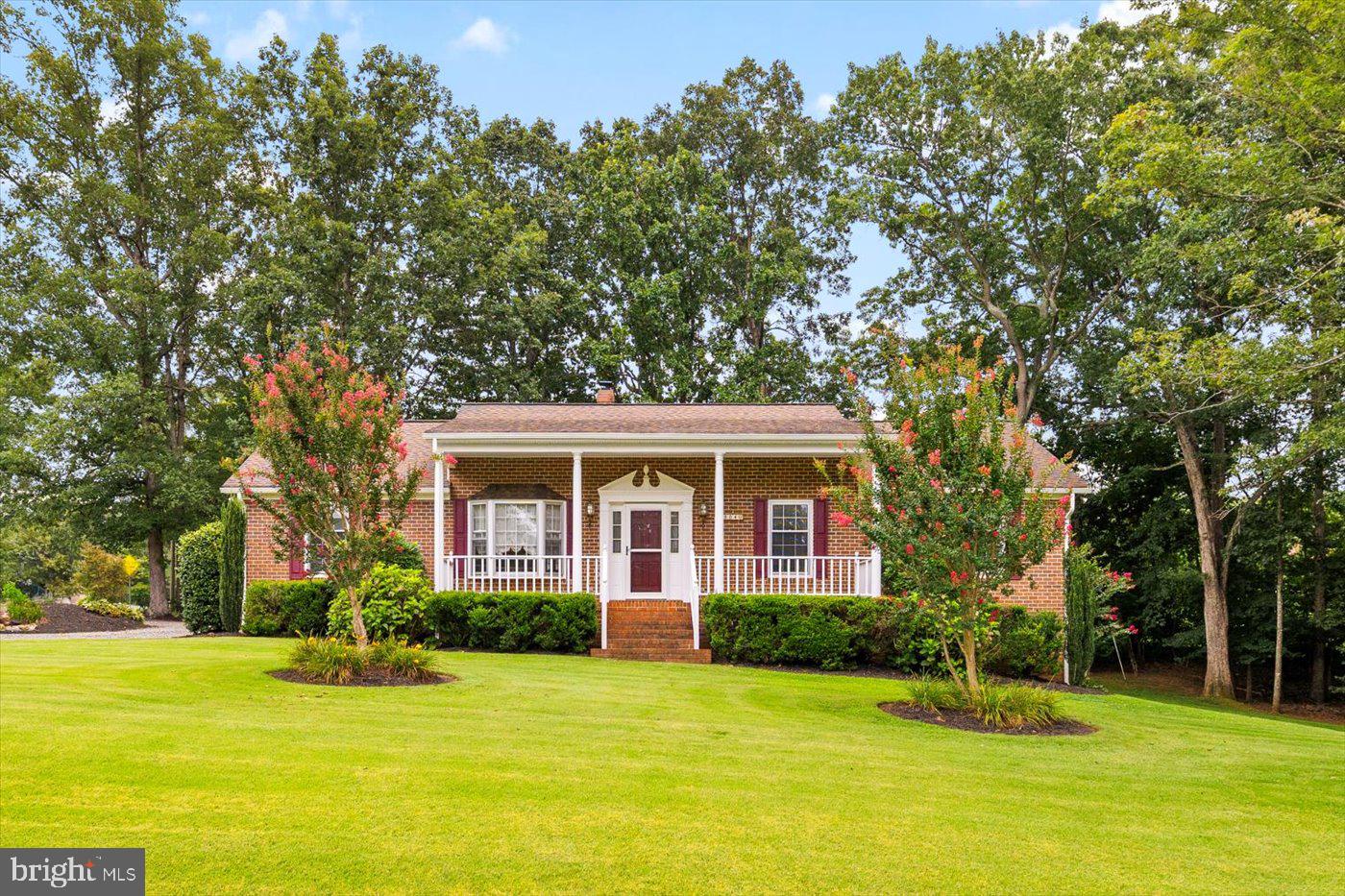 Welcome to this beautifully maintained, all-brick rancher that is move-in ready nestled on a beautiful corner lot consisting of three town lots, in the quaint Town of Mineral, VA.  With high-speed Xfinity Comcast internet, this home combines classic timeless style with today’s modern conveniences, offering the perfect blend of small-town living and accessibility.  Step inside to discover 1,680 finished square feet on the main level, plus 800 finished square feet and an additional 860 unfinished square feet on the lower level—perfect for storage or future expansion.  Featuring 3 bedrooms, 2 full baths, and elegant touches throughout.  The family room welcomes you with a sunny bay window, hardwood flooring, and crown molding, seamlessly flowing into the formal dining room adorned with chair rail and classic finishes.  The spacious eat-in kitchen is a true standout, showcasing rich pine cabinetry with a walnut finish, granite countertops, a tile backsplash, and a pass-through window perfect for entertaining. The main level primary suite offers a relaxing corner jetted tub, while two additional bedrooms, a second full bath, and a walk-in laundry room (washer & dryer convey!) complete the level.  Downstairs, enjoy 800 finished square feet including a large den with a cozy stone gas fireplace and a versatile recreation room—plus 880 square feet of unfinished space ideal for a workshop or extra storage.  Outside is your very own backyard oasis: a refreshing pool, covered pergola, and back deck ideal for summer gatherings and BBQs. The beautifully landscaped yard features a koi pond, a half-circle driveway, and thoughtful upgrades such as 50-year shingles (roof replaced 12 years ago), gutter/leaf guards, a tankless water heater, and a generator hookup with a portable whole-house Generac generator that conveys. Enjoy the convenience of in-town living—just moments to dining, groceries, and banking—while being less than 10 minutes to Lake Anna, where fishing, boating, and lake adventures await. Don’t miss the opportunity to own this rare gem in the heart of Mineral in a prime location.  Schedule your showing today!