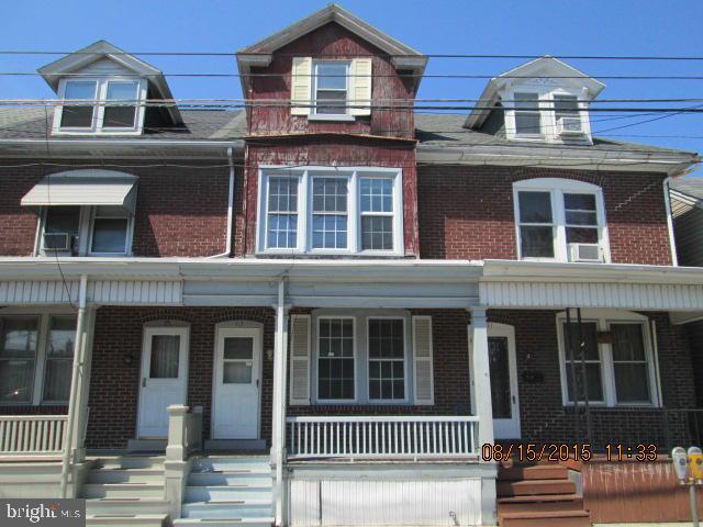 2.5 story brick row home with updated kitchen and bath. Gas heat/CA, front porch, rear deck and fenced yard. Low maintenance exterior, central location.