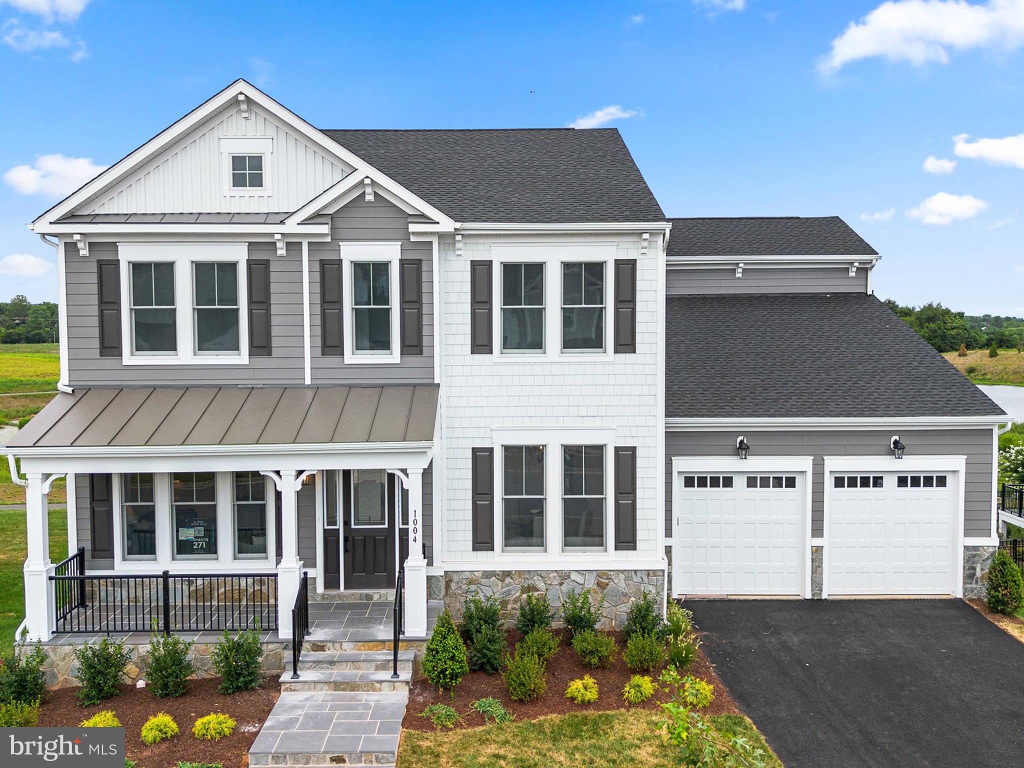 Come claim your new custom home by Van Metre Design+Build Homes in the highly sought-after community of MEADOWBROOK FARM in Leesburg, VA!  This luxurious residence is currently under construction and ready to move in SEPTEMBER 2024, customized with high-end features from top to bottom. Offering a generous 5,419 finished square feet, this BELMONT floorplan features 7 bedrooms, 5 full and 1 half bathrooms, and a 2-car finished garage, providing a perfect blend of space and sophistication. As you enter the home, be greeted by the desirable open floor plan accentuated by an abundance of natural light, engineered hardwood flooring, and lofty 9' ceilings. This masterfully crafted home features a radiant breakfast room, a large great room with gas fireplace, a main-level bedroom with ensuite full bathroom, and separate living and dining rooms to help you maximize your chosen lifestyle. The focal point of the residence unfolds with a stacked, luxury kitchen featuring upgraded cabinets, quartz countertops, GE Cafe stainless-steel appliances, butler's pantry, and a comfortable kitchen island, perfect for both intimate gatherings and grand entertaining. Ascend to the upper level, where luxury reaches new heights. The primary suite is a sanctuary of its own, starring a large sitting area, dual walk-in closets, coffered ceiling, and a 5-piece, spa-like bathroom with double sinks, an oversized, frameless shower with a built-in seat, and a dramatic freestanding tub. Three additional secondary bedrooms, two full baths, and a convenient upstairs laundry room complete the upper level, ensuring comfort and convenience. The luxury continues in the finished basement with an oversized rec room, two additional bedrooms, and one additional full bathroom to help provide added space for relaxation and entertainment. But this is not all! The backyard features a large, rear deck to be enjoyed by all whether it be for quiet evenings or bustling outdoor parties. Being a new build, your home is constructed to the highest energy efficiency standards, comes with a post-settlement warranty, and has never been lived in before! Embrace a lifestyle of opulence and functionality in this meticulously designed home, where every detail reflects a commitment to quality and refinement. ----- Pricing, incentives, and homesite availability are subject to change. Photos are used for illustrative purposes only. For details, please consult a Van Metre Design+Build member.