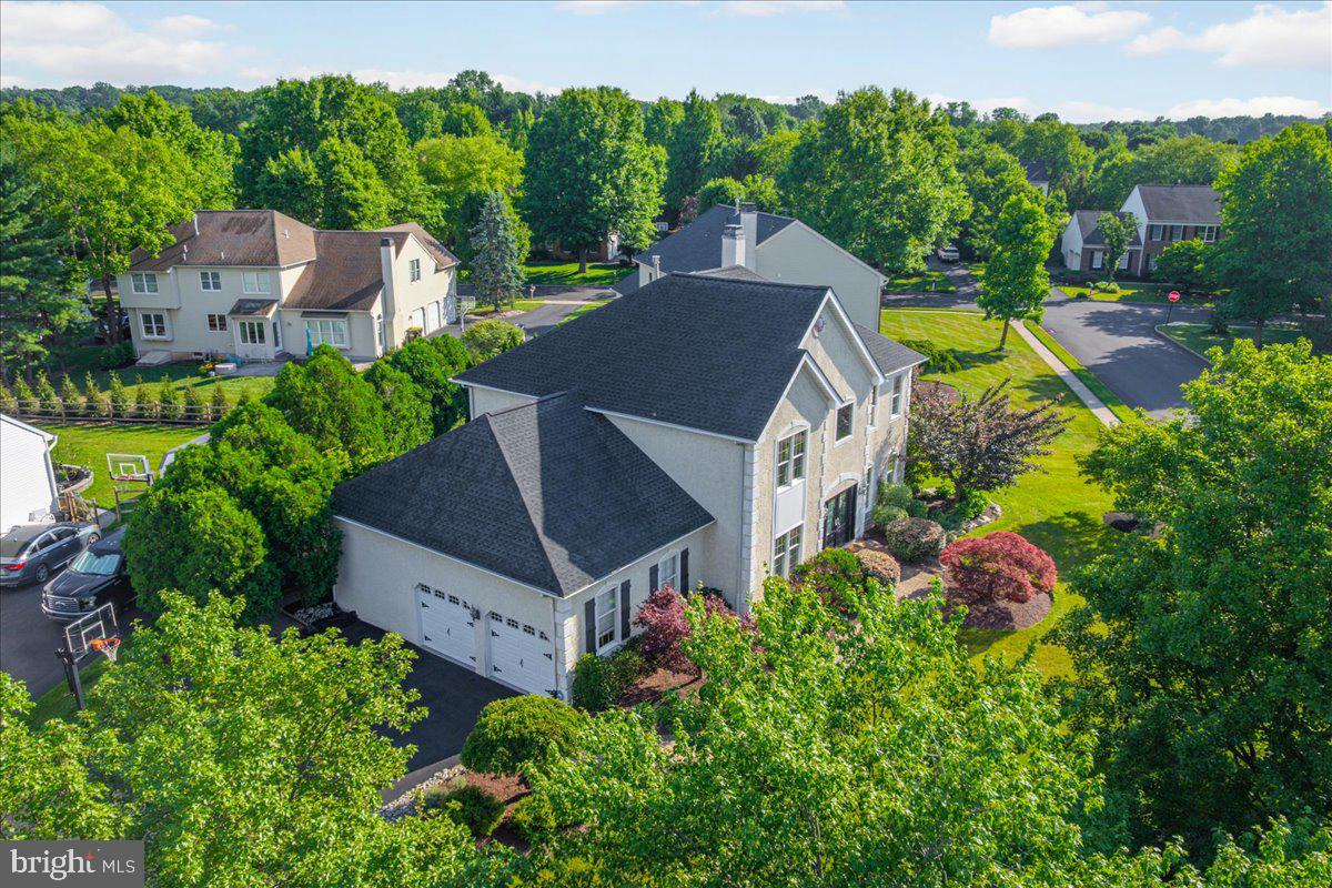 Nestled in the highly sought-after Cold Spring Hunt community, this exceptional Buckingham model offers timeless elegance, thoughtful updates, and outstanding curb appeal. A beautifully landscaped exterior, accented by an EP Henry walkway and tasteful outdoor lighting, creates a warm welcome from the moment you arrive.

Step inside to a dramatic two-story foyer featuring gleaming hardwood floors, custom architectural moldings, and a striking staircase with decorative iron balusters. Designed with both everyday living and entertaining in mind, the formal dining room flows effortlessly into the living room through elegant French doors, creating an inviting space for hosting family and friends.

At the heart of the home, the spacious kitchen blends warmth and sophistication with granite countertops, stainless steel appliances, a large center island, and two generous pantry closets, offering both style and functionality. Just beyond, the sun-filled family room features oversized windows and a cozy wood-burning fireplace, making it the perfect gathering place year-round.

Outdoor living is equally impressive. Step onto the expansive paver patio overlooking a private, tree-lined backyard complete with a built-in AOG gas grill (2024) and a charming wood-burning fire pit—an ideal setting for relaxing evenings or entertaining guests.

The main level also includes a private home office, a convenient laundry room with direct backyard access, and an attached two-car garage featuring an epoxy-coated floor and abundant storage.

Upstairs, the spacious primary suite serves as a peaceful retreat with a tray ceiling, walk-in closet, and a beautifully appointed spa-inspired bath featuring a large glass-enclosed shower. California Closet systems enhance the primary suite and two additional bedrooms, while a fourth bedroom and a full hall bath complete the second floor.

The finished lower level offers exceptional flexibility with multiple spaces for recreation and entertaining, including a granite-topped bar, billiards area, fitness room, and an additional family room.

Lovingly maintained and thoughtfully updated by its original owners, this approximately 3,200-square-foot home showcases pride of ownership throughout. Recent improvements include a newer roof, hot water heater, and freshly paved driveway, providing added value and peace of mind.

Ideally situated within walking distance of Cold Spring Elementary School, Hansell Park, George M. Bush Park, and the scenic Bike & Hike Trail, while just minutes from shopping, dining, and everyday conveniences, this home offers the perfect combination of luxury, comfort, and location.