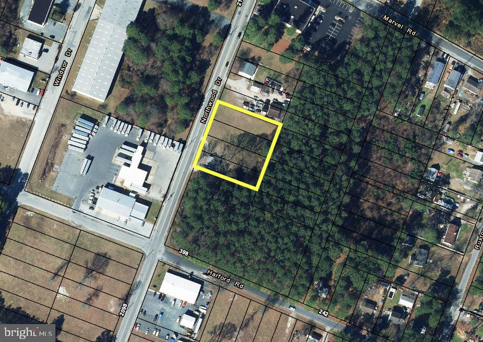 This Light Industrial / Commercial property consist of  4 x 1/4 acre parcels and 1 features a fully updated and remodeled 900 sq. ft. residence with 2 bedrooms and 1 full bathroom, bonus room, laundry room and updated kitchen. New Stainless appliances, flooring, fixtures, paint, walk in tile shower, and HVAC all since 2023. The exterior features privacy fencing, low maintenance composite decking, a large storage shed and an additional detached office / efficiency apartment. The remaining  3 x 1/4 acre parcels are cleared, level and ready to build on. This flexible property has (2) curb cuts with 1 at the residence and 1 providing access to the open space. The business possibilities are endless ranging from service fields, automotive repairs, storage, towing, hauling and distribution.