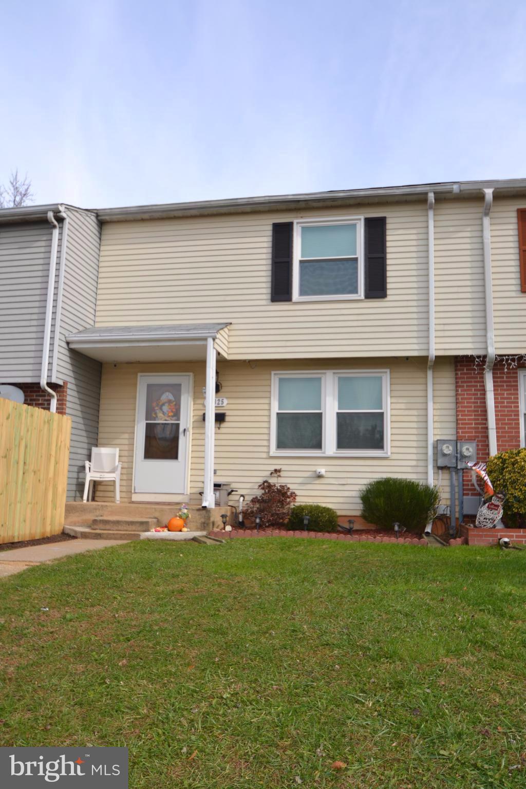 Move in Ready!! This home offers a large updated eat in kitchen which opens to a stairs, patio and fenced yard. Newly finished lower level with laminate floors,  walk out and plenty of storage, new water heater in 2015. Large bedrooms on the upper level, master bedroom with walk in closet. Updated bathrooms. NO HOA! HOME WARRANTY INCLUDED. New windows in 2014!