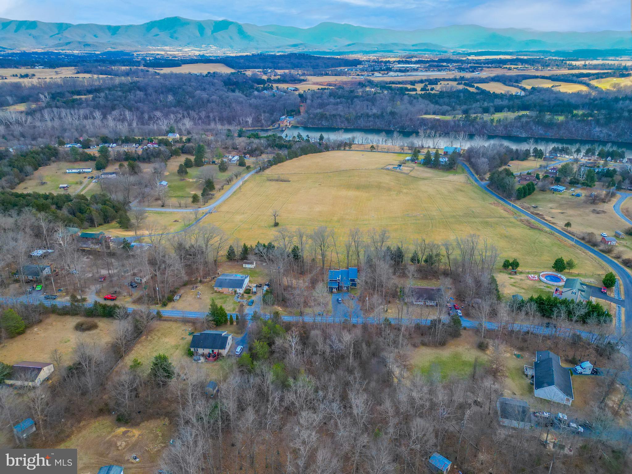 Explore the opportunity that awaits on Riverbend Drive. Located in a quiet riverfront community, this 0.75-acre wooded parcel provides privacy, scenic surroundings, and gentle mountain views—creating a beautiful setting for whatever you have in mind. Whether you’re planning a full-time home, a weekend getaway, a vacation rental, a camping and recreation spot, or a long-term investment, this property offers versatility and appeal. Property owners enjoy private access to the Shenandoah River, situated above the dam in the powerboat-permitted section—ideal for boating, kayaking, canoeing, fishing, swimming, or simply unwinding by the shoreline. The neighborhood also includes a large HOA park and open green space, adding even more room to relax and enjoy the outdoors. Despite its peaceful setting, the property is conveniently close to Luray’s popular attractions, including Luray Caverns, Luray Caverns Golf Course, George Washington National Forest, Shenandoah National Park, local shops, and an array of dining options—offering a wonderful blend of seclusion and accessibility.