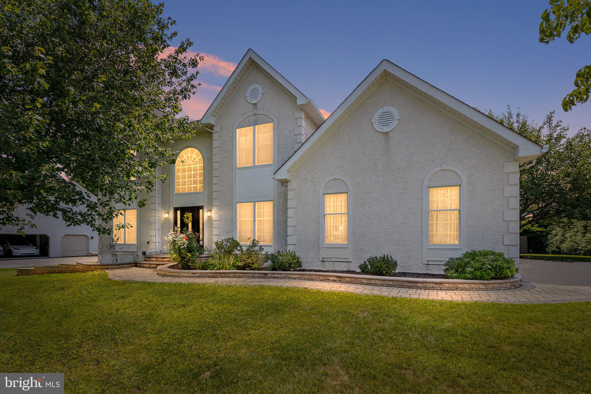 Nestled in the heart of Pike Creek Valley in the highly sought-after community of Hunt at Louviers, this exceptional residence offers the perfect blend of luxury, elegance, and thoughtful design. Boasting 2,775 square feet above grade plus approximately 1,000 square feet of beautifully finished lower-level living space, this meticulously maintained home is situated on a premium lot with an incredible private backyard retreat.

The professionally landscaped exterior features lush gardens, paver walkways, a fully fenced yard, a custom fire pit, and an oversized composite deck with an awning—creating the perfect setting for entertaining or relaxing outdoors.

Inside, you’ll be welcomed by a dramatic two-story foyer and stunning hardwood flooring that extends throughout both the main and upper levels. The sun-filled family room features soaring ceilings with skylights and a cozy gas fireplace, seamlessly connecting to the spectacular, fully remodeled chef’s kitchen. Designed with both style and function in mind, the kitchen showcases gorgeous white 42-inch cabinetry, Grassi sintered stone countertop, with a striking waterfall island, designer backsplash, and premium stainless steel appliances, including a GE thermal wall oven and microwave, Jenn-Air downdraft cooktop, Kenmore Elite bottom-freezer refrigerator, and Bosch dishwasher.

Upstairs, you’ll find four spacious bedrooms and two full bathrooms. The expanded primary suite is a true retreat, featuring an oversized walk-in closet and a luxurious, fully renovated spa-inspired bath with beautiful slate tile, double vanity, soaking tub, separate shower, and high-end finishes throughout.

Additional highlights include a convenient first-floor laundry room featuring Samsung washer and dryer, an attached two-car garage with two garage door openers, and an updated front entry door with sidelights that enhances the home’s curb appeal.

The finished lower level adds approximately 1,000 square feet of versatile living space with brand-new carpeting, a second fireplace, and abundant unfinished storage, making it ideal for a recreation room, home gym, office, or media space.

Every detail of this extraordinary home has been carefully curated to create an exceptional living experience. Combining timeless elegance, modern upgrades, and an unbeatable Pike Creek location, 317 Amoroso Way is truly a place you’ll be proud to call home.
