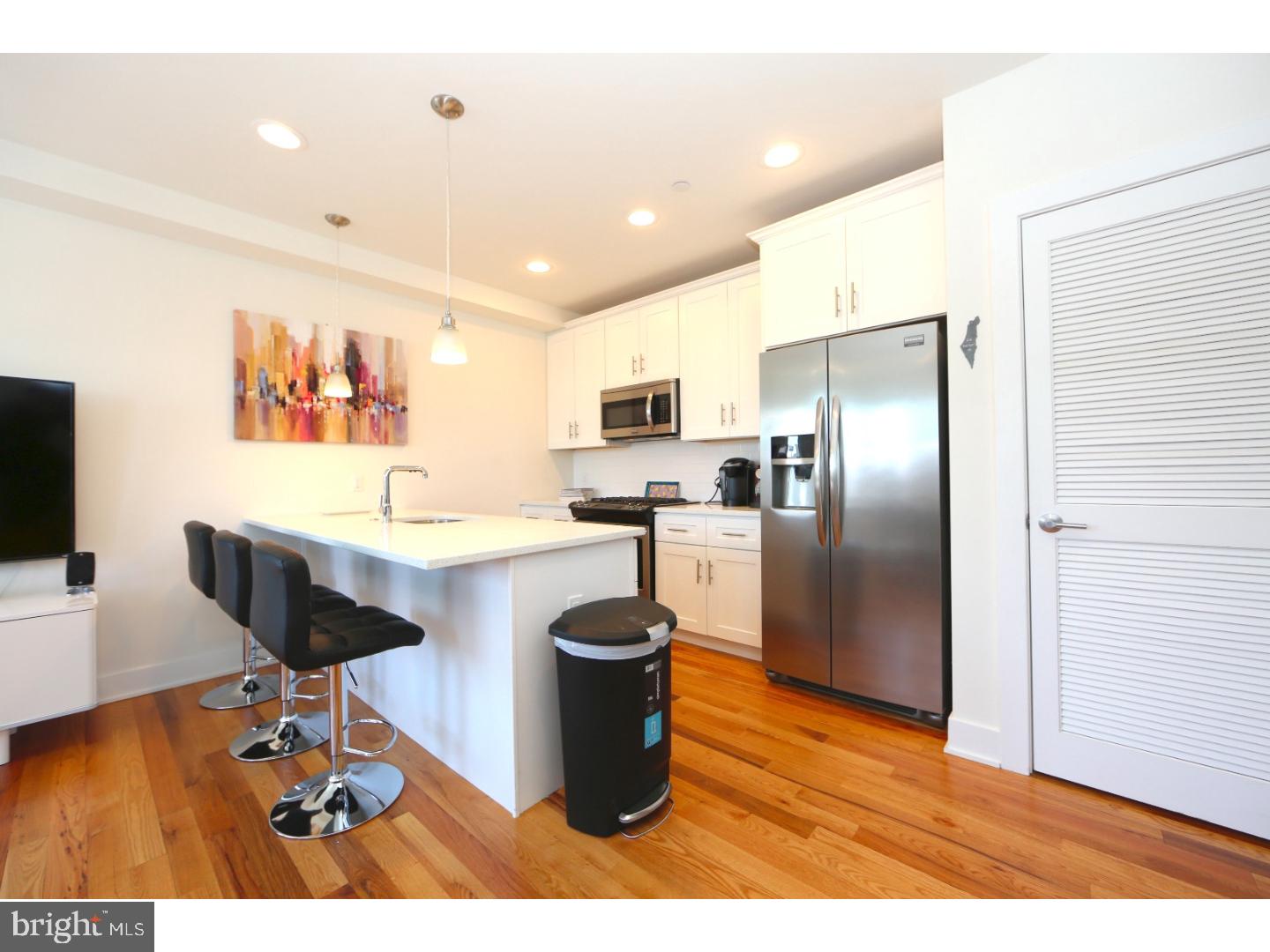 Chic, sophisticated and light filled condo in the Heart of Northern Liberties. This meticulously maintained unit has modern upgrades throughout, such as recessed LED lighting, custom window treatments and decorative bathroom tile, as well as being an end unit, which offers additional privacy.  This gorgeous two bedroom, two bath condo boasts high ceilings and abundant sunlight throughout. The kitchen is equipped with stainless steel appliances, gas cooking, subway tile and gorgeous pendant lighting. Spacious living area along with private balcony. Hallway full bath w deep tub/shower combo and beautiful tile. Side bedroom w huge closet space! Owner's suite has private bath w large, glass enclosed shower, walk in large closet w custom built storage. This is also an elevator building to all floors which goes down into the secured garage where you have 1 car deeded parking and fully automatic overhead door and bike storage! There are approximately 9 years left on the Tax Abatement which is also included! Walk score of 97! Stroll to SEPTA, North 3rd Restaurant, Standard Tap, JAXON and numerous other cafe's, bars and pubs! A minute to  Orianna Dog and few more to the Fillmore and The Schmitz Commons! Make your appointment today!