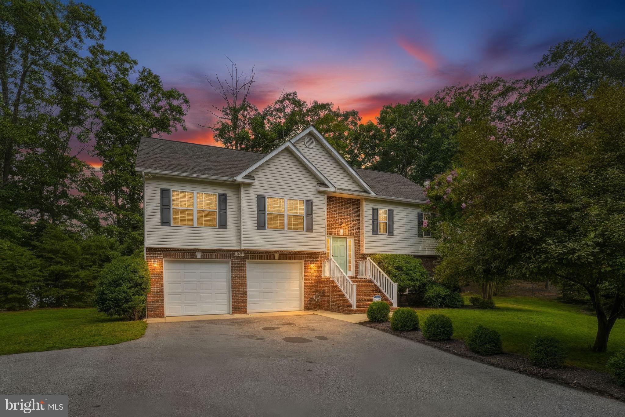 This 4-bedroom, 3-bath home in the desirable Town Creek community of St. Mary's County offers over 2,300 total square feet on nearly half an acre. This one-owner home features hardwood floors throughout the main level, a gas fireplace with a stone accent wall, and a renovated kitchen with quartz-style counters, a subway-tile backsplash, and additional cabinet space.

The main level offers 3 bedrooms, including a primary suite with a large walk-in closet, a separate walk-in shower, and a soaking tub with a double-sink vanity. The hall bathroom features a new vanity and mirror.
In the fully finished lower level, the 4th bedroom, a separate large rec room, a full bath, ideal for guests, a home office, or extra living space. Just steps from the walkout to the patio, a utility sink offers a convenient spot to rinse off tools and grilling gear before a cookout.

Oversized 2-car garage with inside access and a garage door opener. Outside, enjoy the deck and a two-level stone patio with a fire pit area overlooking the nearly half-acre wooded lot, plus a backyard zip line for added outdoor fun, ideal for entertaining. HVAC and water heater are both approximately 3 years old.
No HOA! Residents of Town Creek enjoy access to a community pool available with membership, plus a tennis court and playground. Centrally located in Lexington Park, close to shopping, dining, and NAS Pax River, this move-in-ready split foyer won't last long.