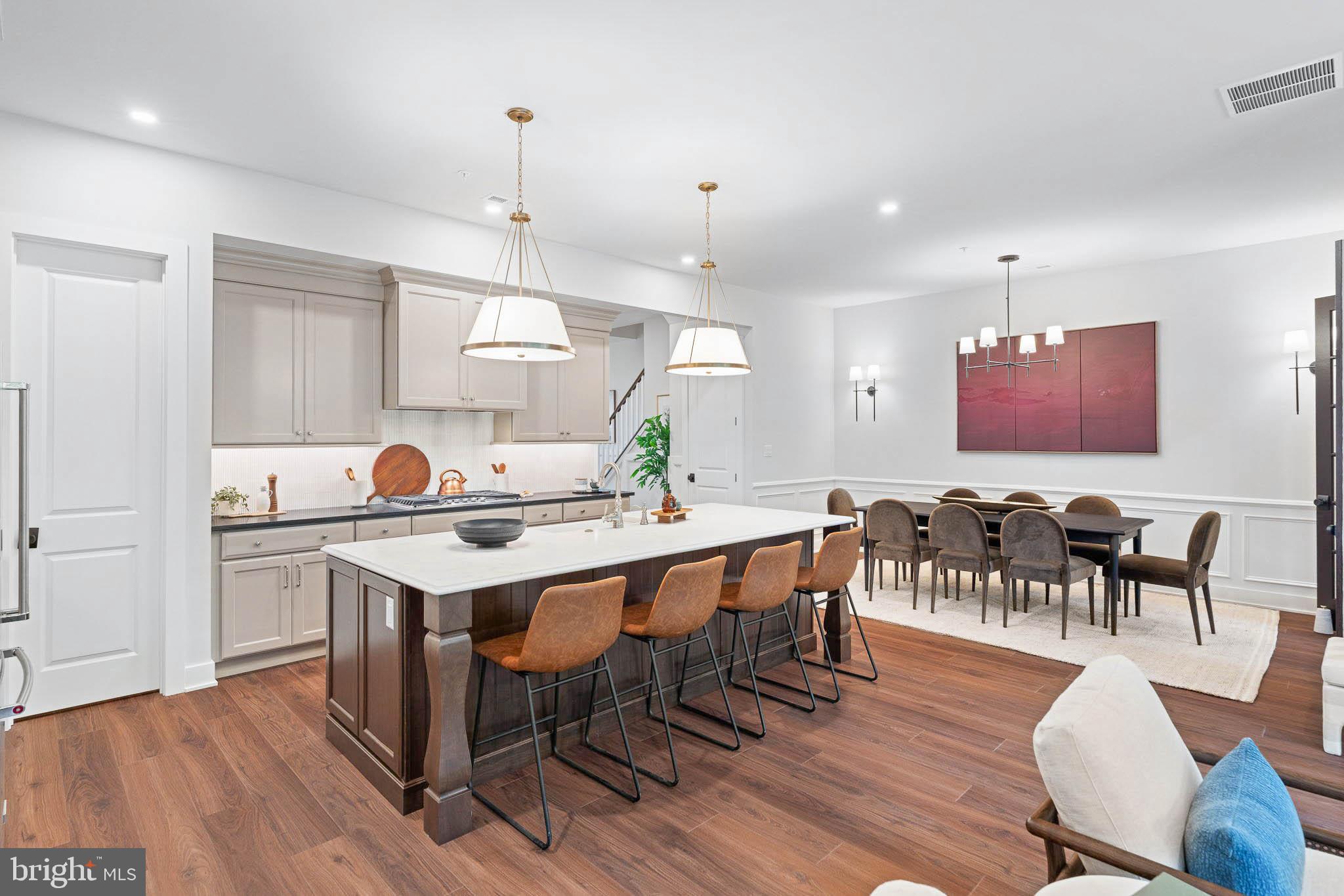 Experience luxury, low-maintenance living in this stunning Harper Grand carriage home at River Trail at Valley Forge with direct access to the Schuylkill River Trail leading to Valley Forge National Historical Park and just minutes from King of Prussia Town Center shopping and dining.  This move-in ready home features a finished walkout basement, chef’s kitchen with built-in appliances, modern finishes, and an open-concept layout filled with natural light. The main level impresses with 10’ ceilings, 8’ doors, oversized great room windows, and a dining area that opens to an elevated composite deck for easy indoor-outdoor living.  Upstairs, the private primary suite offers two walk-in closets, and a spa-inspired bath with dual quartz vanities and walk-in shower. Two additional bedrooms, a full bath, and laundry room complete the upper level.  Enjoy outdoor adventure and convenience in one of King of Prussia’s most exciting new communities. Summer 2026 move-in. Photos are representative of the Harper Grand Model Home, now open for touring!
