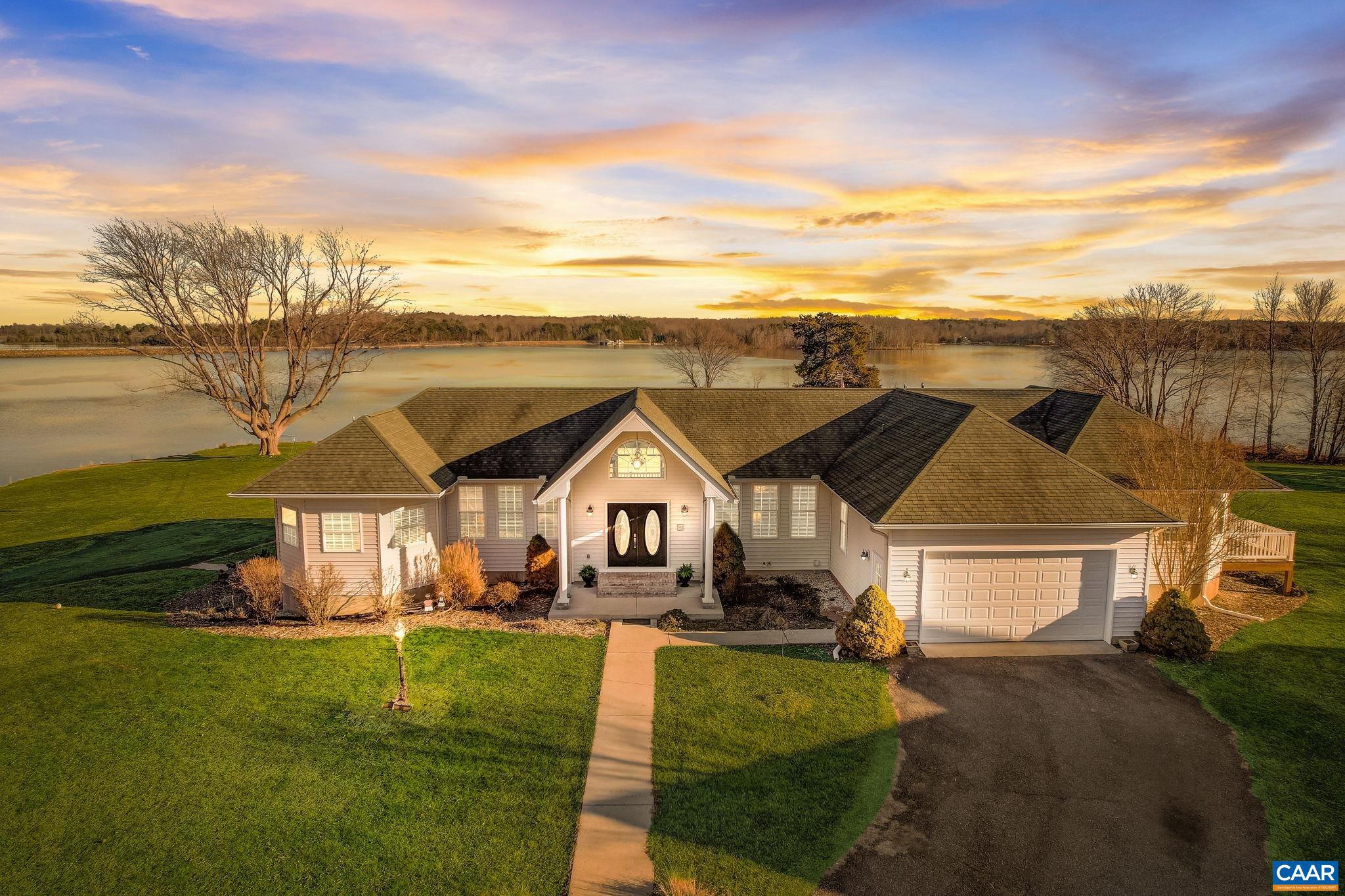 Welcome to lakeside living at Brown?s Point, a truly exceptional opportunity to own a lakefront property boasting unparalleled vistas of Lake Anna. With over 800 feet of private waterfront, this location offers a panoramic 180° view that is simply breathtaking. This custom home seamlessly blends indoor and outdoor living, offering breathtaking views from every angle. Inside discover a thoughtfully designed layout where the Vaulted Great Room and Kitchen beckon with abundant natural light, direct deck access, and a gas fireplace for cozy evenings. The expansive primary suite serves as a serene retreat, featuring a private balcony perfect for moonlit moments, his & her bathrooms and closets, and a Spa room complete with a walk-in shower and jetted tub?all accompanied by sweeping lake views. The guest wing, features two bedrooms w/ private bathrooms, as well as a deck and cozy sitting area?ideal for unwinding or hosting visitors in comfort & privacy. On the lower level, you'll discover two more guest rooms, a theatre room, a hobby room, and a second office space?all centered around a spacious open area perfect for entertaining. And of course the second kitchen with a gas stove. Outside you will fi,Granite Counter,Fireplace in Great Room