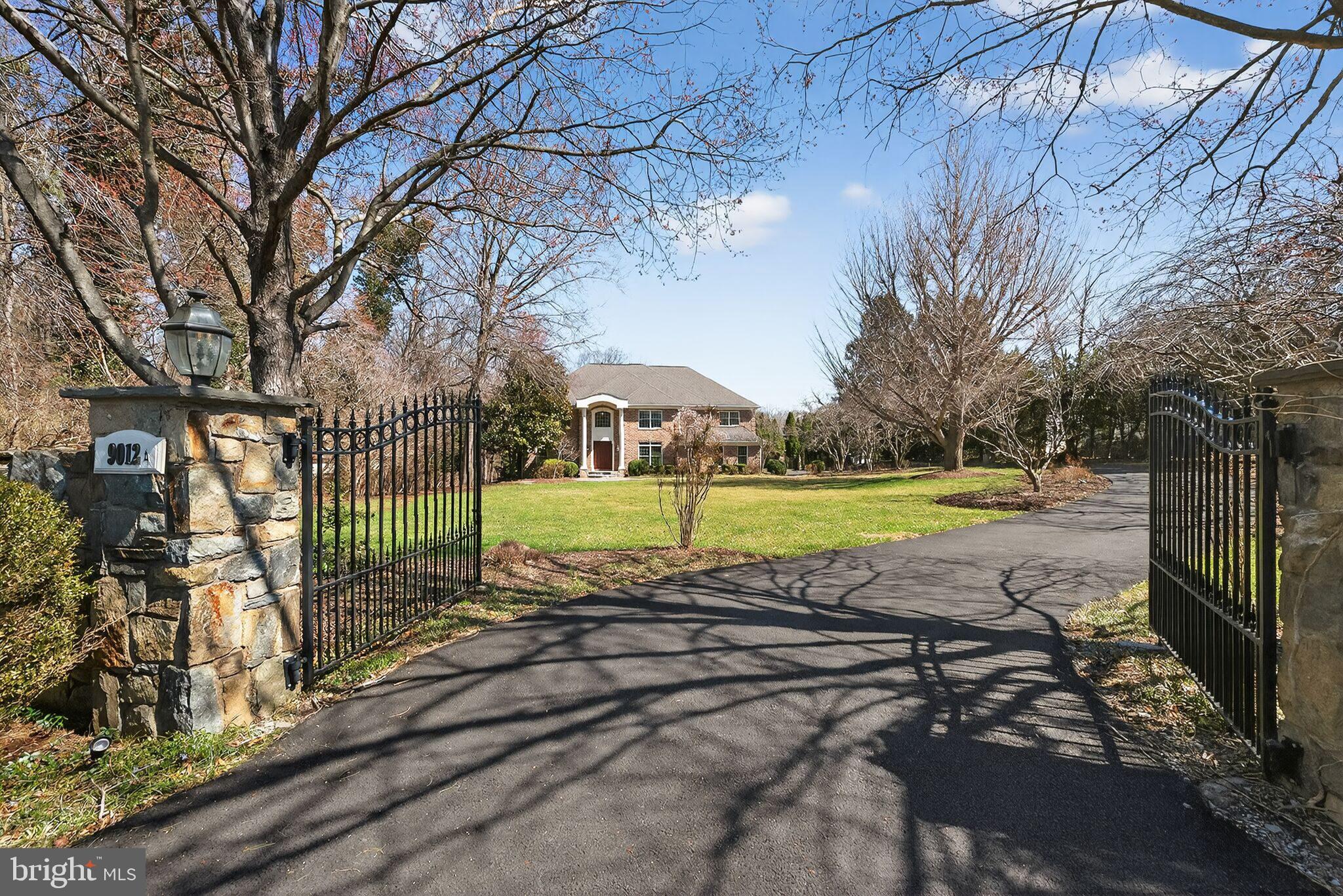 Price Reduced $200,000. New improvements to the kitchen and bathrooms have just been completed.

Nestled on nearly 1.4 acres of serene, gated grounds, this impressive all-brick Colonial exemplifies scale and sophistication. Spanning over 8,000 square feet, the estate seamlessly blends grand entertaining spaces with intimate retreats. The backyard feels like a private club, featuring an expansive deck and patio system, a shimmering pool, and a personal golf complex with a tee box, sand trap, and putting green.

Inside, a striking two-story marble foyer sets the tone for an open, thoughtfully designed layout. From the gourmet kitchen to the formal living room’s wood-burning fireplace and the family room’s stone gas fireplace, front and rear 2-story staircases, every detail is purposeful.

The primary suite functions as a private wing with built-ins and a sitting room, offering a luxurious salon bath and dual boutique-style closets. The upper floor includes a bright, spacious loft and three additional ensuite bedrooms, each with its own bathroom.

The walk-out lower level serves as the ultimate recreation hub, with a wine cellar, wet bar, theater, and professional dance studio.

Located in the prestigious Langley Pyramid, you are minutes from the natural beauty of Great Falls Park and the Difficult Run Stream Valley Trail, with convenient access to fine dining, shopping, cultural centers, the Metro Silver Line, GW Parkway, Dulles International Airport, and the vibrant energy of Tysons and DC.
