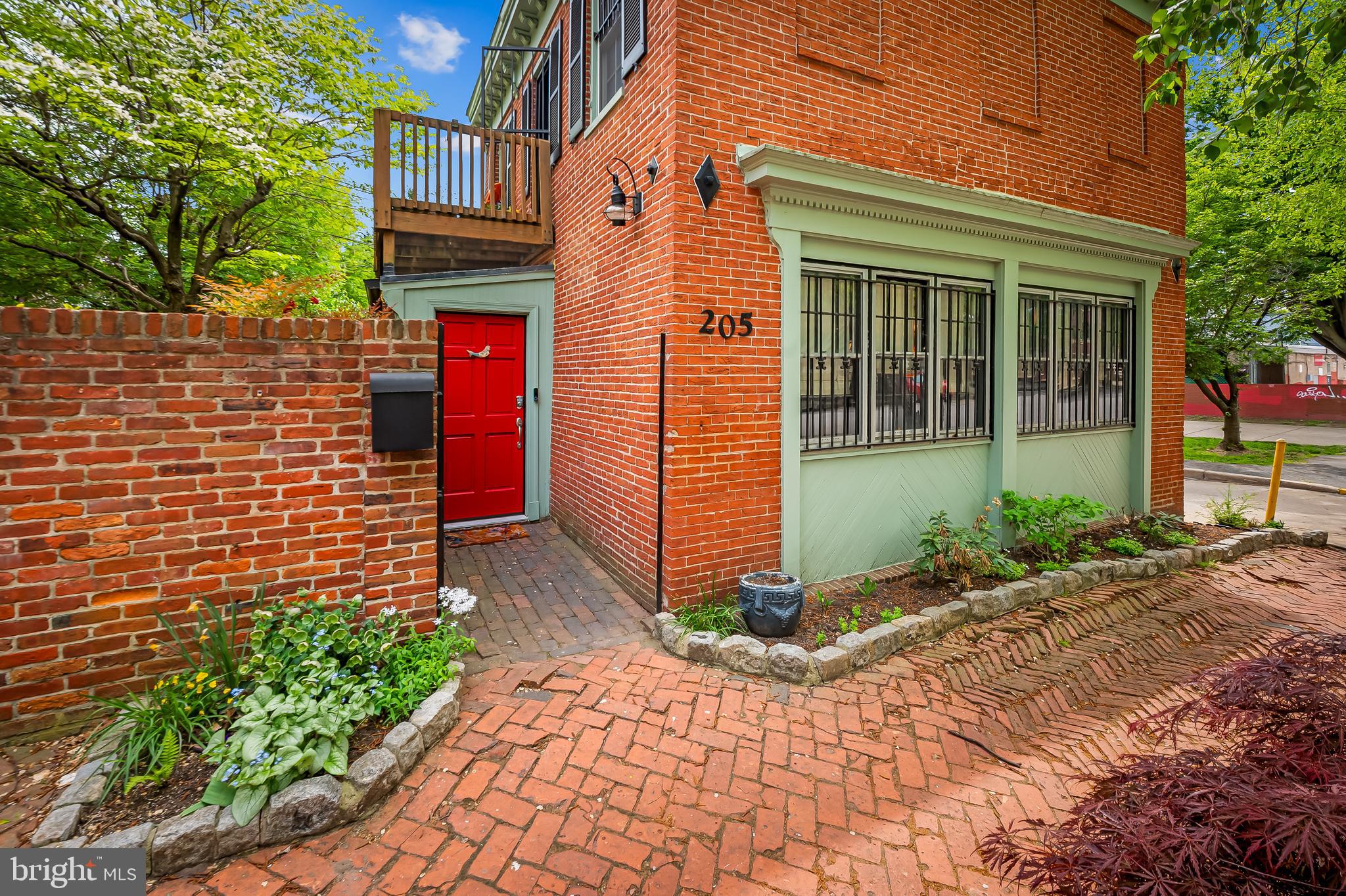 Beautiful Historic Carriage house in the heart of historic Bolton Hill.  Light filled rooms, wood burning stove, washer dryer combo in unit, beautifully renovated kitchen and full and half bath.  Deck off master bedroom.  Home is being rented fully furnished and includes electric, gas and water.  Street parking