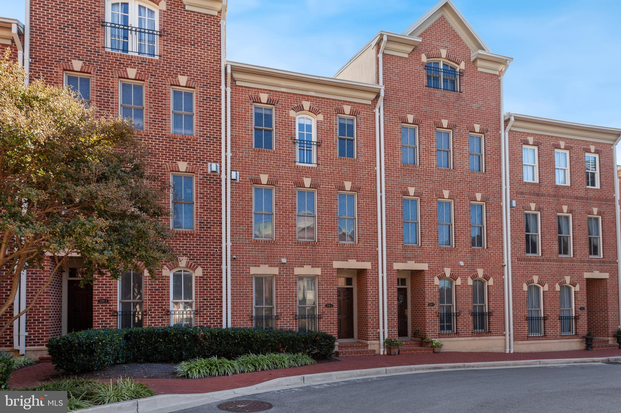 Experience refined city living in this luxury three-level townhome located in the highly sought-after North Shore community of Canton. Perfectly positioned in an ideal, walkable location, this home is just steps from popular restaurants, boutique shops, waterfront promenades, and neighborhood parks.

Inside, you’ll find a thoughtfully designed layout featuring a gourmet kitchen with rich cherry cabinetry, granite countertops,  gas cooking, stainless steel refrigerator, island with breakfast bar and seamlessly opening to an outdoor balcony ideal for morning coffee or evening unwinding. Elegant hardwood floors, 9-foot ceilings, and a cozy gas fireplace with mantle enhance the main living areas with warmth and sophistication.

The spacious primary suite offers a relaxing retreat complete with a large en-suite bath with double sink vanity and soaking garden tub.  An additional fairly sized bedroom and full bath with tub/shower combo completes the upper level. A first-floor bedroom provides flexibility for guests, a home office, playroom, or multigenerational living.

Additional highlights include an all-brick exterior, two-car garage, and two additional driveway parking spaces, offering rare and convenient parking in the city. Set within a water-oriented community, this exceptional townhome blends luxury, comfort, and unbeatable Canton convenience.  *Owner is a licensed Realtor