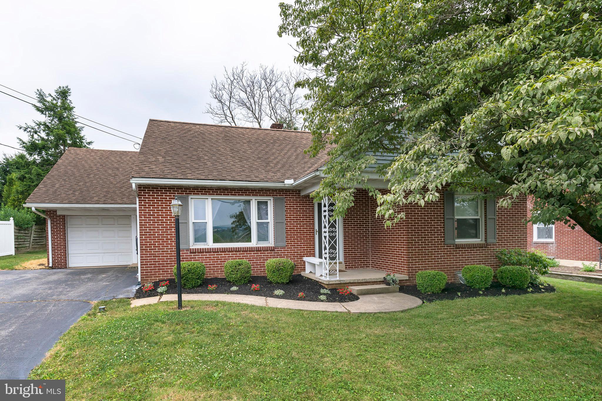 Adorable solid brick 1 1/2 story cape cod home with farmland view. 3 bedrooms 2 full baths. Brand new 2nd floor with 3rd bedroom, office, and tile bathroom. Eat-in country kitchen with pantry and all appliances. 2 bedrooms and tile bath on 1st floor. Large living room. New tilt in windows. Garage, workshop in lower level. Nice backyard with mature shade trees,  Front porch, Affordable single home in Manheim Central.