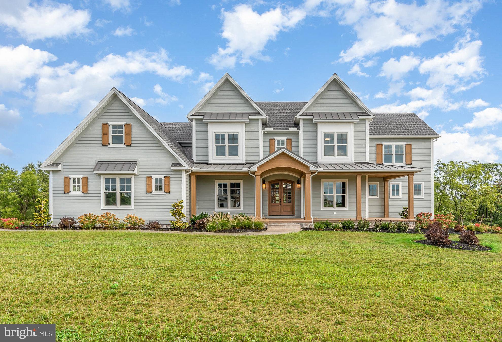 Welcome to Farm Crest in South Hanover Twp.  This Foxbuilt custom home is what dreams are made of. The exceptional craftsmanship, thoughtful attention to detail, unique finishes, and top of the line materials will stand out as you approach the home, even before you enter.  After walking through the foyer, complete with real brick flooring, the home opens to a 2 story ceiling and open concept.  Your eyes will go from 3/4" solid white oak floors, customed stained on site, to a beautiful 2 sided, real brick, gas fireplace that leads to custom beams that are a feature throughout the first floor. Off of the great room is a gourmet kitchen, large island, custom cabinets, and a pantry big enough to live in.  No amenity was overlooked as one of the garage access doors leads into the pantry to make unloading groceries a breeze. The kitchen leads through a solid brick wall mirroring the fireplace to a dual purpose dining and sitting area.  From there you access the large covered deck complete with the other side of the dual sided fireplace. First floor owners suite is just one of two ensuites in the home. It is complete with an electric fireplace, custom bath, and huge walk in closet with it's own laundry. The first floor ensuite also has direct access to the covered deck. The second level has 4 more bedrooms with one of them being the second option of owners suite complete with full bath, custom cabinets, and walk in closet. Two of the remaining three bedrooms share a Jack and Jill bath.  The firth bedroom, another full bath, and bonus room over the 3 car garage complete the second floor.  The walkout basement is on it's way to finishing your dream space with 10 foot superior walls that are insulated and framed ready for electric and drywall.  The basement is also rough plumed for a full bath.  This Foxbuilt home is the epidemy of craftsmanship and design that will make you never want to leave, and excited to come home.  Truly a must see!