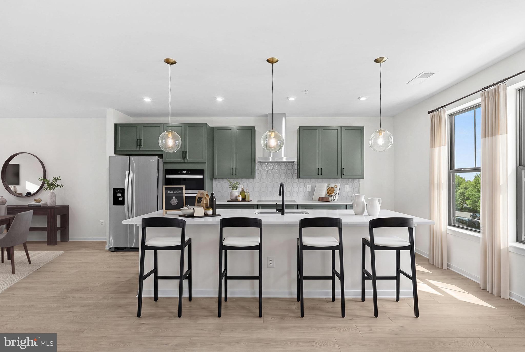NEW CONSTRUCTION. Special All-In Price, for August Delivery! Special all in price, ready for August move in! Receive $25K in Closing Costs until 6/30 with a Choice Lender. See New Home Counselor for details. Welcome to the Katharine, a brand-new, upscale stacked townhome in the sought-after Belmont Park community in Ashburn, VA. This 2-level home with a 1-car garage is designed for convenience and style, perfect for those ready to move quickly! Featuring 4 bedrooms and 3 baths, this home boasts a modern kitchen with 42” cabinets, LED lighting, quartz countertops, and stainless-steel Whirlpool appliances. This luxury home stands out with a rare main level 4th bedroom, offering the perfect solution for guests or a private home office. A generous kitchen island and open concept main level is designed to live large, with expansive rooms that flow effortlessly for everyday comfort and easy entertaining. The spacious primary suite includes a generous walk-in closet and a luxury bathroom with raised double vanities and a walk-in spa shower. Plus, the garage comes equipped with an EV charger-compatible outlet for future-ready living. Enjoy low-maintenance living with snow removal, lawn care, and exterior upkeep all handled for you—giving you more time to enjoy life, not maintain it. Hometown heroes get $2,500 (restrictions apply; see New Home Counselor for details). Belmont Park offers resort-style amenities including bocce ball, volleyball, playgrounds, community greenspace, and more. Located in Ashburn, you’ll have quick access to major roadways, Dulles Airport, and endless dining and entertainment. Beazer Homes at Belmont Park are designed to live better day to day, with energy-efficient construction that lowers monthly utility costs, thoughtful design options that make personalization simple, and Mortgage Choice, where our top lenders help you compare options and save money on your home loan. This high-performance home is built to lower your total cost of homeownership through reduced utility bills, durable materials, and high-quality construction that minimizes long-term maintenance costs. Beazer Homes is proud to be America’s #1 Energy Efficient homebuilder. Our FY25 average gross HERS score of 32 (38 excluding solar) was the lowest of the publicly reported scores among the top 30 U.S. homebuilders by volume identified by Builder Magazine’s Top 100 List (based on 2025 total closings). Get protection against rising energy costs without changing how you live. Every Beazer home is pre-wired for solar, making it easier and more affordable to add a renewable system when you are ready. Photos of similar home. Model Home Hours: Mon–Sun, 11 AM–6 PM. Use 19758 Misty Moss Square Ashburn, VA 20147 for GPS directions. Parking will be next to our Information Center trailer. Please go to the model home listed here first.