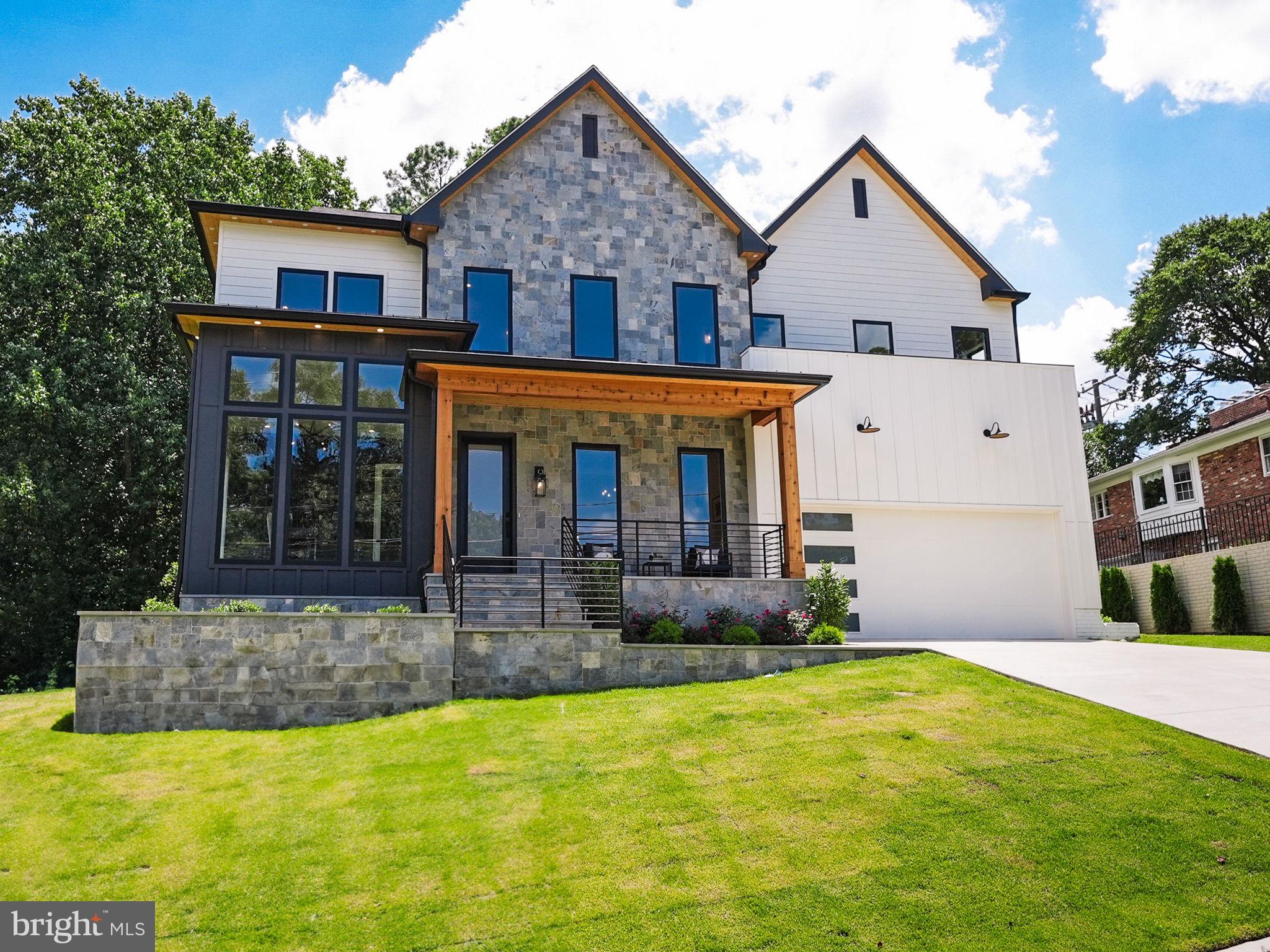 Introducing a contemporary marvel nestled within the sought-after neighborhood of Chain Bridge Forest in North Arlington. Crafted by HR Developers, this modern masterpiece stands as a testament to luxury living, offering a harmonious blend of sophistication and convenience. Meticulously designed and move-in ready, this residence presents an unparalleled opportunity to indulge in elevated living.

Boasting 6 bedrooms, 6.5 bathrooms, and sprawling across a generous 6,756 square feet, this residence exudes grandeur at every turn. Upon entry, be greeted by 10-foot ceilings and exquisite white oak hardwood floors that seamlessly guide you through the main level. A chef's dream, the gourmet kitchen is adorned with premium appliances, including a 48" Wolf range and a 48" Subzero stainless steel refrigerator.

Convenience meets luxury with a guest suite on the main level, providing flexibility and ease for residents and guests alike. Step outside to discover an outdoor oasis, complete with a rear deck and a charming screened porch, perfect for al fresco dining or simply basking in the tranquility of the surrounding greenery.

Ascending to the upper level, revel in the opulence of the owner's suite, featuring a private balcony, dual walk-in closets, and a spa-like bathroom replete with double vanities, a glass-enclosed shower, and a freestanding soaking tub—an indulgent retreat for relaxation.

The lower level of the residence offers further allure, with a spacious recreation room, wet bar, exercise room, additional bedroom with a full bathroom, and ample storage space, ensuring versatility to accommodate various lifestyles.

Notable features include a built-in elevator shaft, poised for potential future conversion, and Andersen windows that flood the home with natural light, enhancing the overall ambiance.

Ideally situated near Chesterbrook Shopping Center, Potomac Overlook, Gulf Branch Parks, and Washington Golf, residents enjoy both tranquility and accessibility. With easy access to GW Parkway and mere moments from DC, commuting is effortless. Esteemed schools such as Jamestown Elementary School, Williamsburg Middle School, and Yorktown High School further enrich the appeal of this location.

Don't miss the opportunity to experience contemporary living at its finest in one of North Arlington's most coveted neighborhoods. This residence stands as a true gem, awaiting your discerning eye.