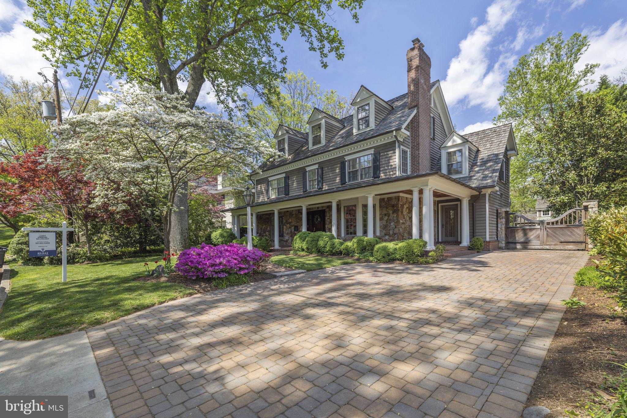 **Photos Coming Friday 4/19/2024**

Indulge in the epitome of luxury living with this meticulously crafted residence, built by renowned builder, Bethesda Builders. Step onto the sprawling wraparound front porch adorned with custom fieldstone elevations, setting the tone for the exquisite interiors that await within.  Experience a seamless flow throughout four finished levels, meticulously designed with the finest materials and expert craftsmanship. The heart of the home, a gourmet kitchen with a central island, seamlessly transitions into a fabulous great room boasting a majestic stone fireplace and bespoke cherry cabinetry.  Discover refined spaces throughout, including a custom milled mahogany paneled library with built-in bookcases, accessed through pocket doors from both the living and family rooms. Retreat to the deluxe primary bedroom suite, featuring a grand entry foyer, gas fireplace, custom wood paneling, and a lavish ensuite bath for unparalleled relaxation.  Ascend to the exceptional top floor, where a private studio/office awaits, bathed in natural light from skylights and cathedral ceilings. Additional bedrooms, a second office, and a spacious bonus room complete this level, offering versatility and comfort for every lifestyle.  Entertain with ease in the fully finished lower level, boasting a large recreation/game room, gas fireplace with stone surround, second kitchen, full bath, fully equipped gym, and additional bed room.