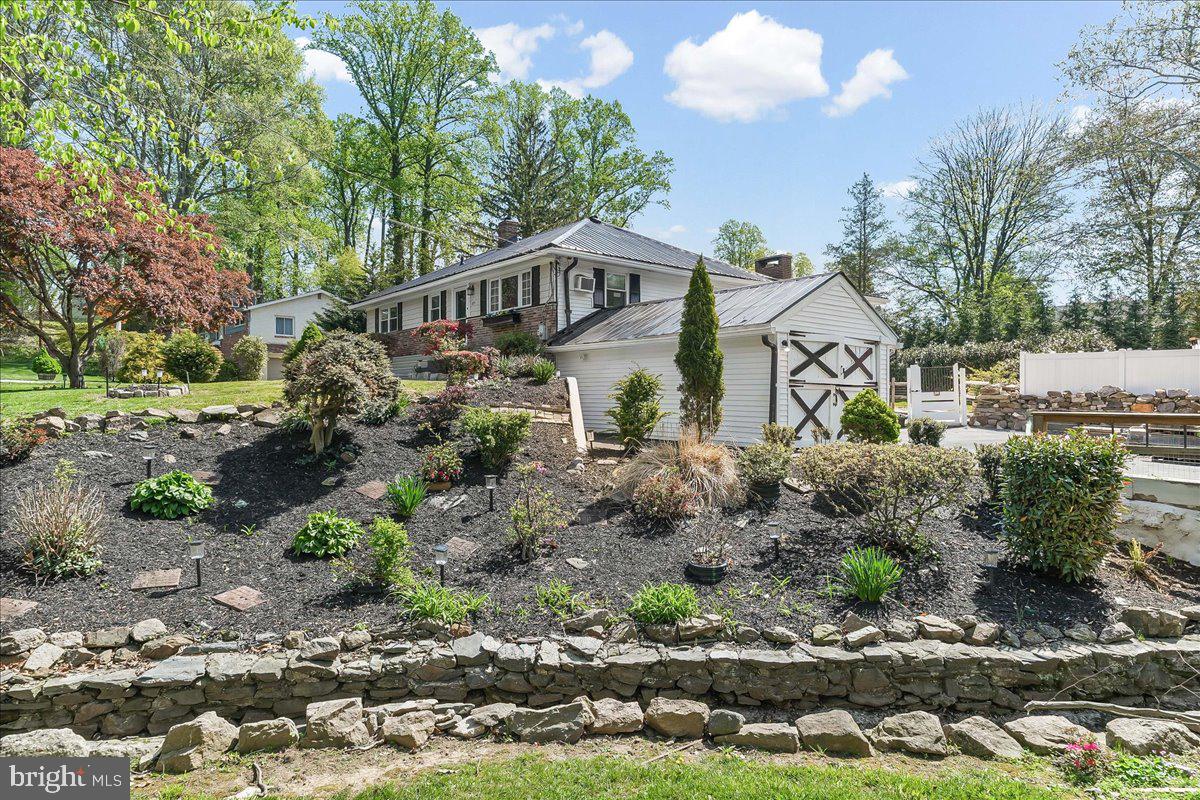 Looking for an in-law suite option in your new home? Check out this spacious expanded ranch home located on a large lot with in-law suite in the Newtown Heights neighborhood in Newtown Square.  Great potential to convert the attached 12 x 24 separate single garage next to the additional two car garage. Consider converting the oversized single car garage into an in-law suite with a separate entrance with windows on 3 sides of the converted suite. Lovely and spacious three bedroom and three full bath home with a daylight finished walk-out lower level with an in-law suite option.  Open floor plan with family room with fireplace which leads to a covered porch. Perfect location for your grille! The kitchen with a skylight is open to the family room and dining room areas. Upon entry to this home, you have a bright and cheery living room. Storage galore in the home. Hardwood floors on the main level. The finished lower level, currently used as an in-law suite, also has a full bath, laundry and storage area. Currently the owner has the lower level set up as a guest room. Perfect for a contractor and or hobbyist with an attached oversized two car garage plus an extra deep large one car garage as well. Many homes in the area are also adding a second level to ranch homes as well, if desired, should you need a larger home. So many options to consider or just enjoy the space and tranquility of 225 Chestnut Street with its beautiful landscaping, fenced in yard, and expanded driveway. Public sewer & Public water. Conveniently located a few streets away from the Newtown Township Public Library, township building with sports courts as well as the Newtown Edgemont Little League and Girls Softball Petticoat fields.  Culbertson Elementary School. Also located across the street from this neighborhood is the Ellis Preserve Shoppes and Restaurants such as Sedona Taphouse, Paris Baguette, Turning Point Cafe, Ruth Chris Steakhouse, Whole Foods and Ulta.