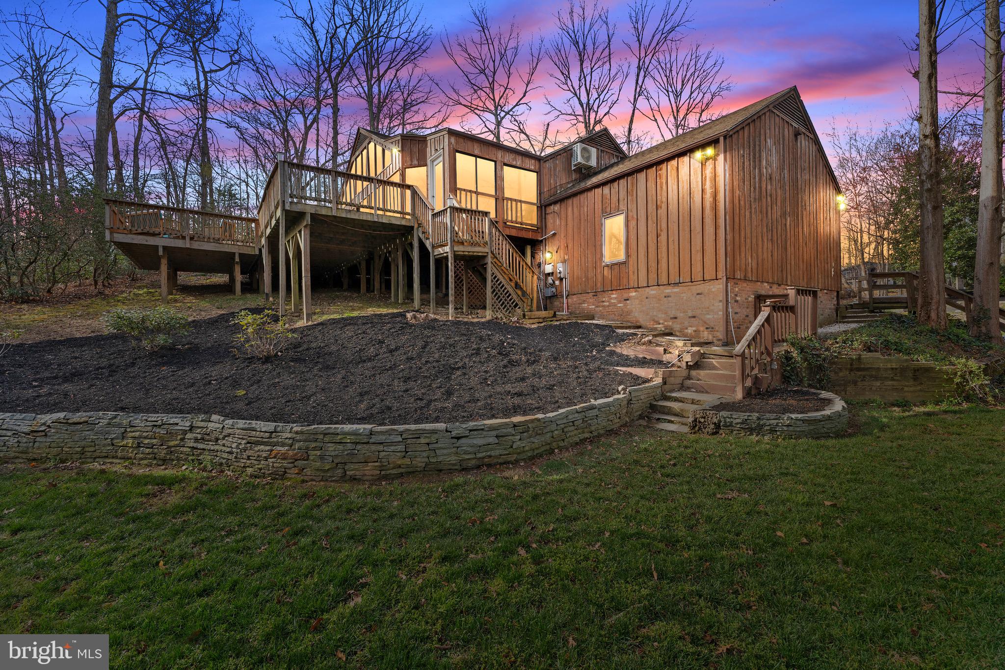 Back on the market - no fault of sellers. Stunning and truly unique, this half-acre retreat in the highly sought-after Braehead Woods neighborhood offers the rare combination of privacy, nature, and city convenience. Just minutes from downtown Fredericksburg and backing directly to National Park Service land, you’ll enjoy immediate access to trails, paths, and wooded serenity right outside your door.
The updated kitchen features granite countertops and opens seamlessly to the dining and living areas, creating a layout perfect for modern living and entertaining. A standout feature of the home is the expansive fully conditioned 14x35 sunroom, accessed through two sets of sliding glass doors off the main living area. From there, step onto the massive wraparound deck, newly stained and surrounded by mature trees—your own private oasis, all within the city limits.
The fully finished lower level includes a private entrance and full kitchen, making it ideal for an in-law suite, au pair accommodations, or multi-generational living. Recent updates include a brand-new HVAC system, fresh interior paint throughout, new carpet, new luxury vinyl plank and deck staining.
Homes like this—tucked into nature yet moments from downtown—are a rare find.