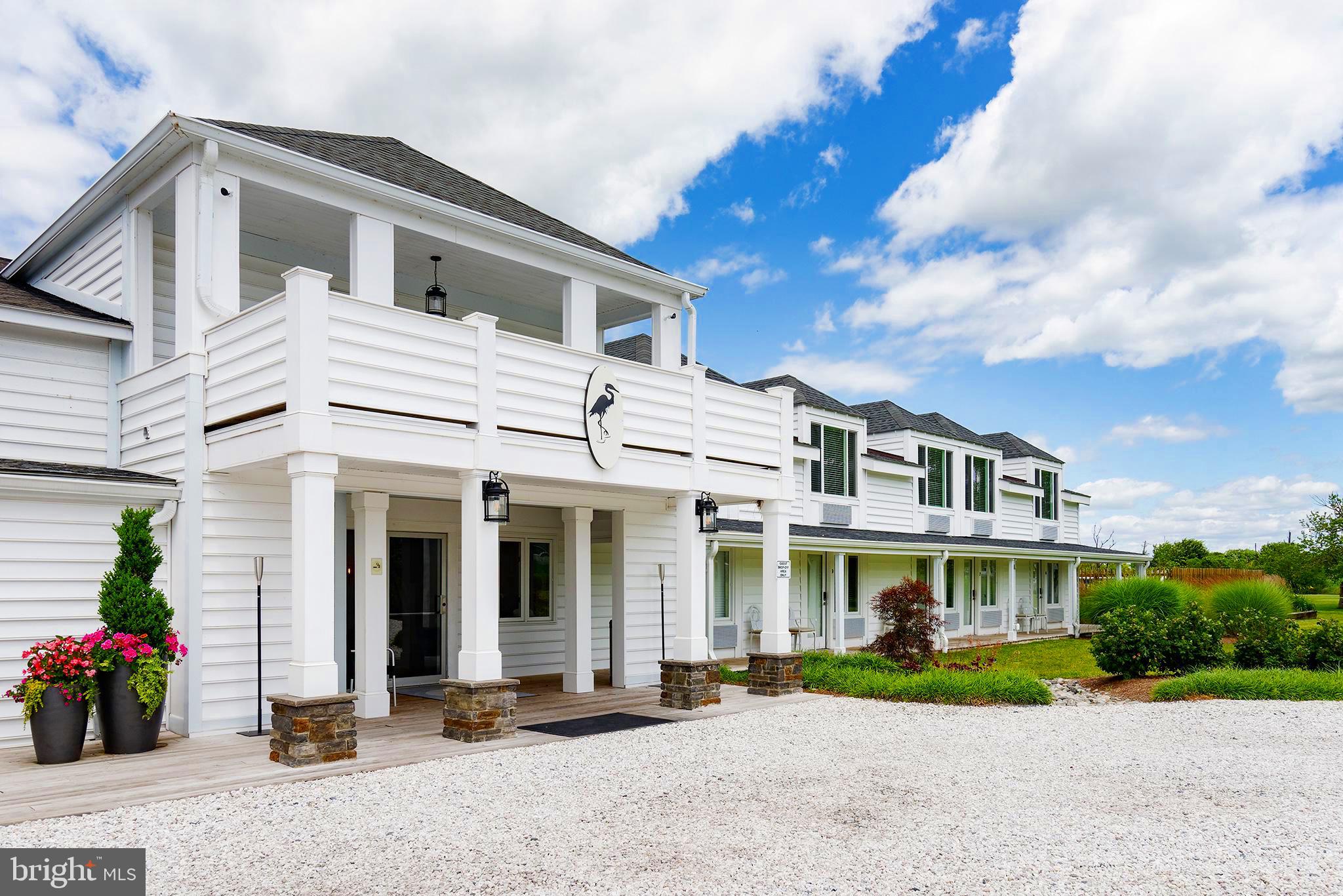 *A Once-in-a-Lifetime Chesapeake Bay Waterfront Offering – The Iconic Tilghman Island Inn* 

NOTE: Has public sewer and well. 

Welcome to a rare opportunity to own one of the most beautiful, fully reimagined waterfront hospitality properties on Maryland’s Eastern Shore. Set on five acres with sweeping views of the Chesapeake Bay, the Tilghman Island Inn is that extraordinary blend of romance, lifestyle, and investment that rarely becomes available. Established more than 50 years ago, the Inn has been transformed from top to bottom through a meticulous, comprehensive renovation. Today, it lives as a boutique luxury retreat with 20 uniquely designed guest rooms (five with gas fireplaces), a full-service waterfront restaurant and bar, expansive outdoor dining terraces, a sparkling 20' x 40' pool, lush gardens, and expansive private docking with the relaxed charm and quiet sophistication that define the Chesapeake Bay. Guests return year after year for the Inn’s serenity, sunset views, on-site dining, and proximity to St. Michaels, Easton, and Annapolis. For buyers, the value is just as clear: major improvements are already complete, systems are up to date, and recent guest ratings average about 95% across major travel platforms. Whether you envision this as a turnkey boutique hotel, a private family compound, a luxury event destination, or a future waterfront condominium development, the property is positioned for success. The Inn is legally configured as 20 residential condominium units offering flexibility. Property Features: 5-acre waterfront property, 15,000+ sq. ft. hotel and restaurant, 345 ft. vinyl seawall, 20 x 30 ft. T-Dock, 175 ft. floating dock with 7 additional boat slips, 20 uniquely designed guest rooms, 20 x 40 ft. in-ground pool, 30 x 12 ft. fully functional greenhouse, and Lush ornamental and raised bed vegetable gardens For investors seeking a premier turnkey hospitality venture or a high-value waterfront development opportunity, the Tilghman Island Inn presents a rare chance to own an Eastern Shore gem with limitless potential. **NOTE: FOR BROCHURE & VIDEO CONTACT AGENT**