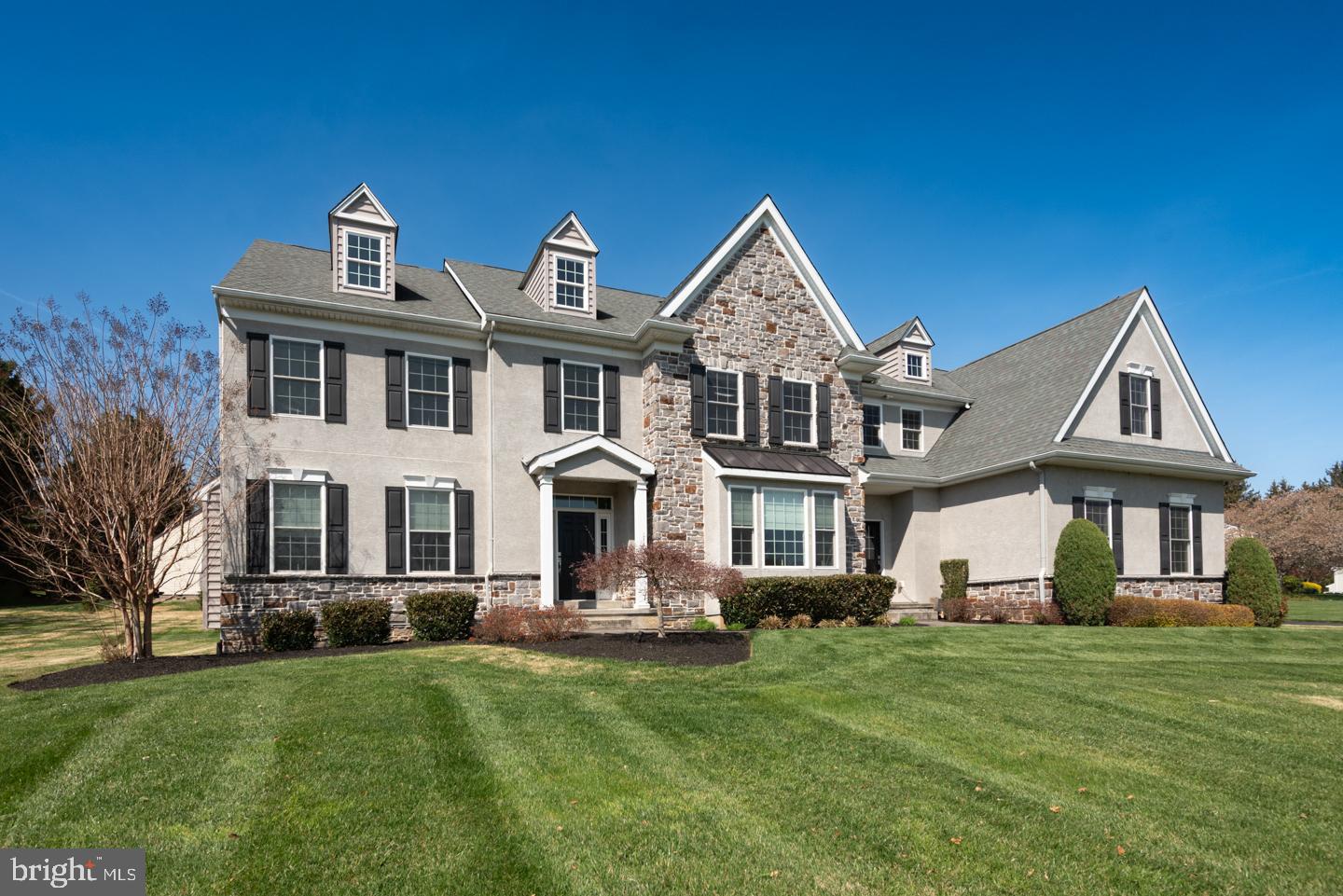 Picture perfect gem in the heart of Garnet Valley! Elegant & sophisticated 4 bedroom 4./2 bath Stone front colonial ideally situated on a beautiful once acre lot. The first floor has gorgeous hardwood floors throughout and  a wonderful open floor plan. Entry foyer, living room with gas fireplace, formal dining room, study, powder room, a magnificent kitchen featuring gleaming granite counters and high end stainless steel appliances, morning room and spacious family room with second gas fireplace. An outside entrance leads to an amazing patio with wood burning fireplace which overlooks the private rear yard.  Informal powder room off of the secondary family entrance. Hardwood floors in the second floor hallway and additional hardwood flooring in the stunning primary suite. Sumptuous primary bath with gorgeous tile work. 3 additional bedrooms one with it's own private ensuite and a third bathroom. Finished walk up basement with tons of light pouring in. Plenty of space for home theatre, fitness area and pool table. Wet bar with wine fridge and beverage fridge, gorgeous granite top and kitchen area, Enjoy the convenience of an additional full bath on this level. 3 car attached garage. The perfect location within the acclaimed Garnet Valley School System and close to fine restaurants and shopping. Enjoy after dinner walks in the quiet walkable neighborhood. Mint condition, a great floor plan and the finest amenities.